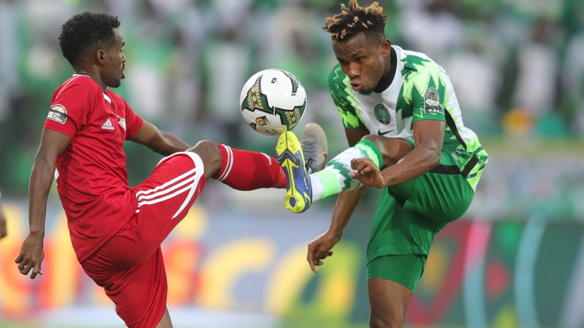Samuel Chukwueze of Nigeria challenged by Abdelrazig Yaoub Omer of Sudan.