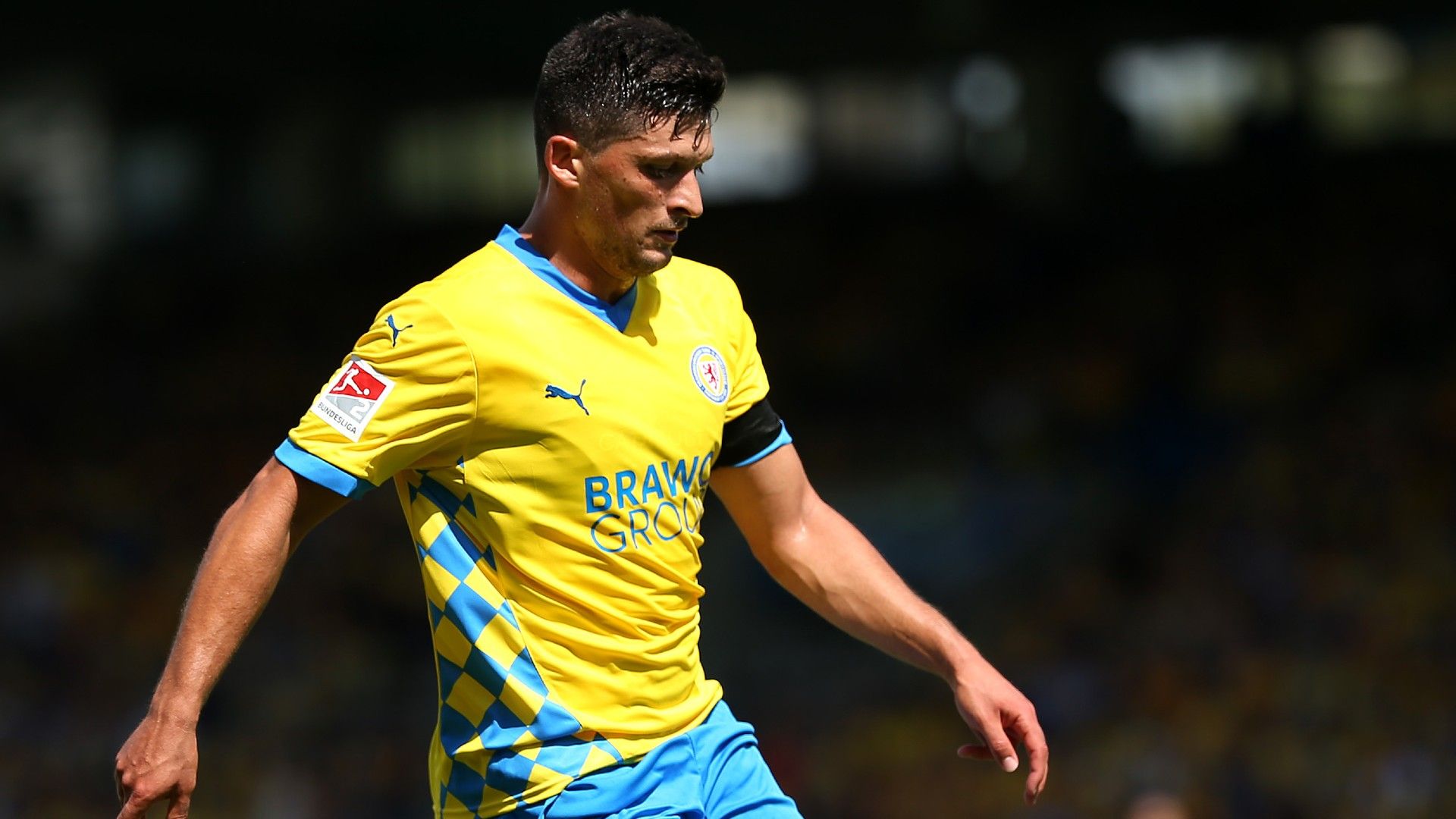 Jannis Nikolaou of Eintracht Braunschweig runs with the ball  