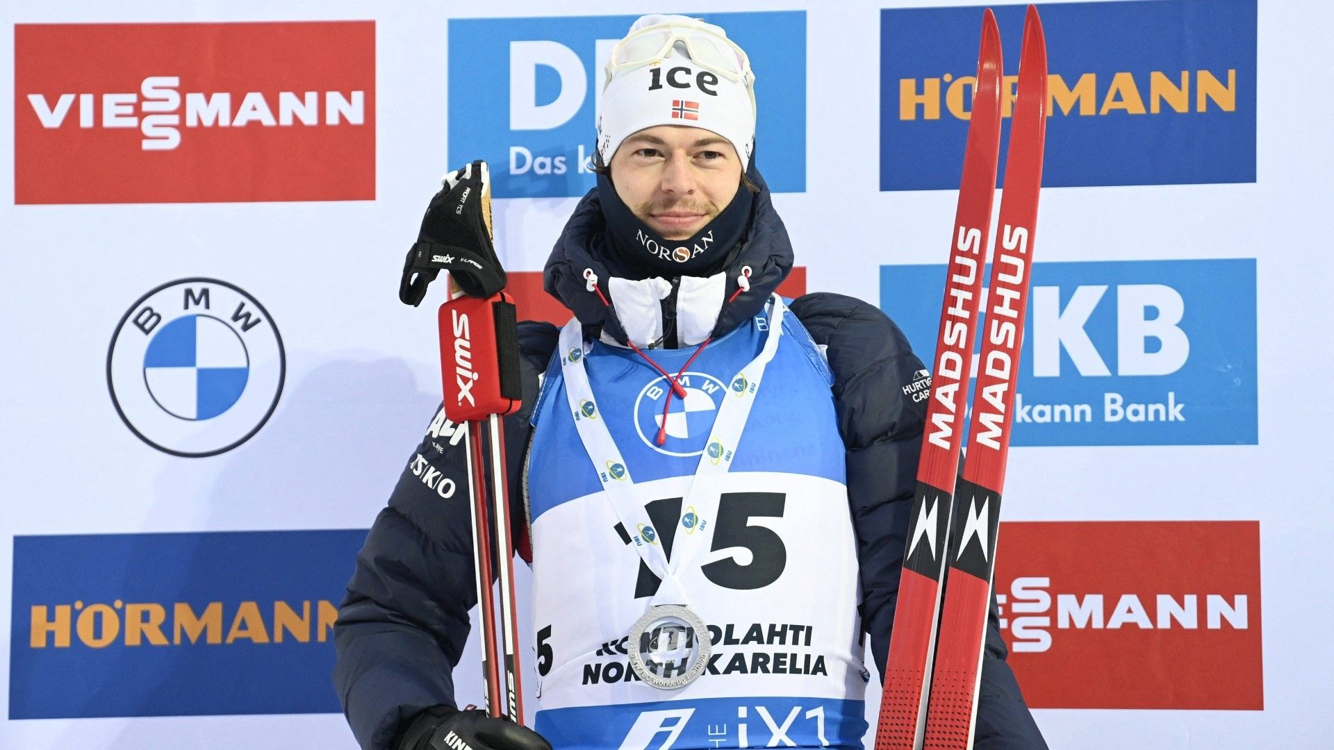 Norway's Sturla Holm Laegreid poses on the podium