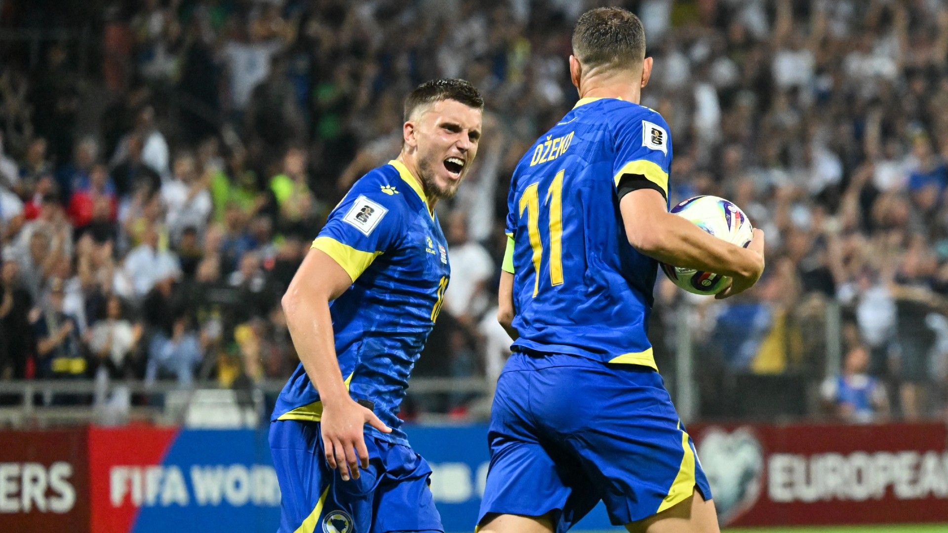 Bosnia and Herzegovina's forward #09 Ermedin Demirovic (L) celebrates
