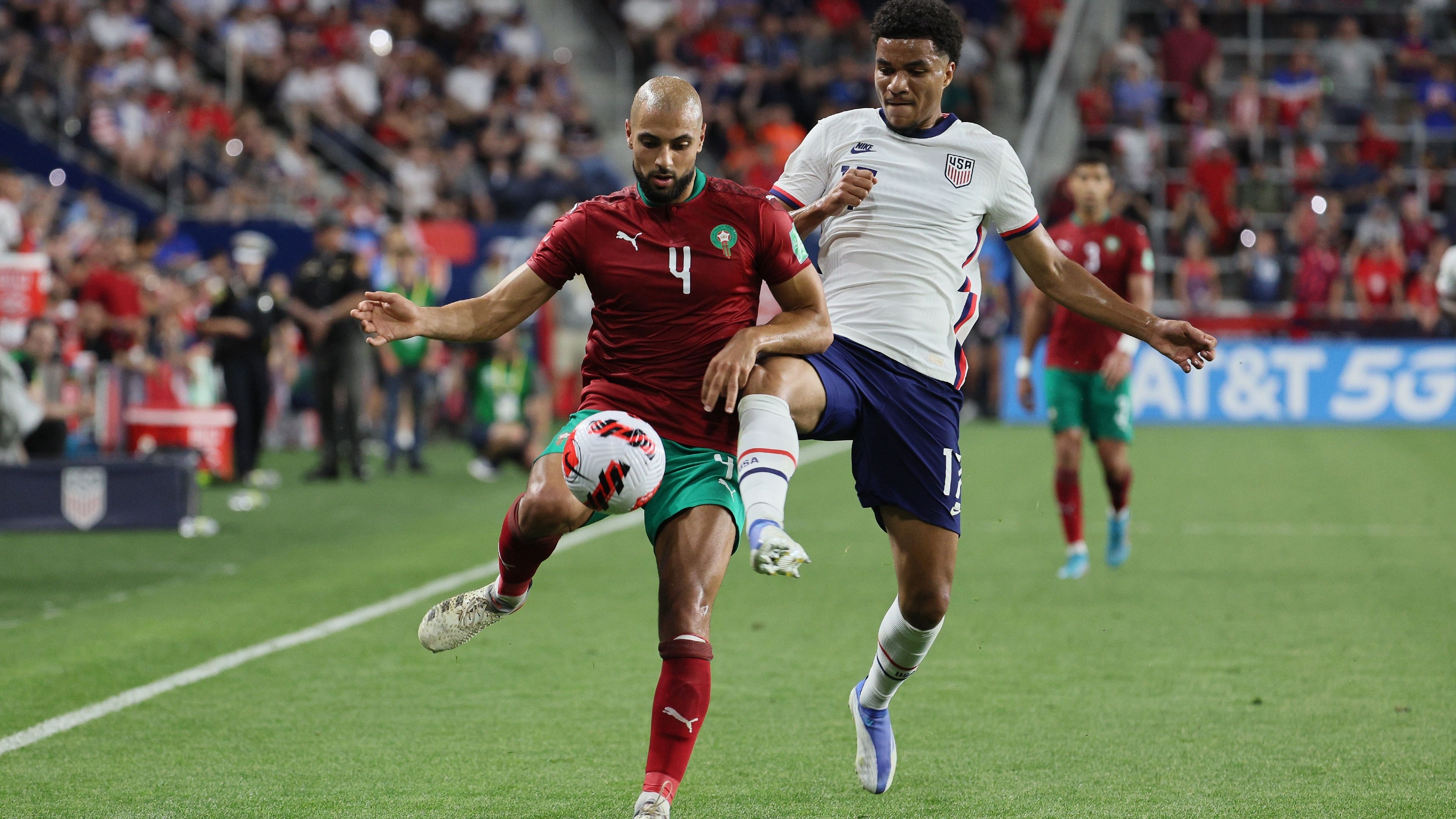 Malik Tillman #17 of the United States and Sofyan Amrabat #4 of Morocco 