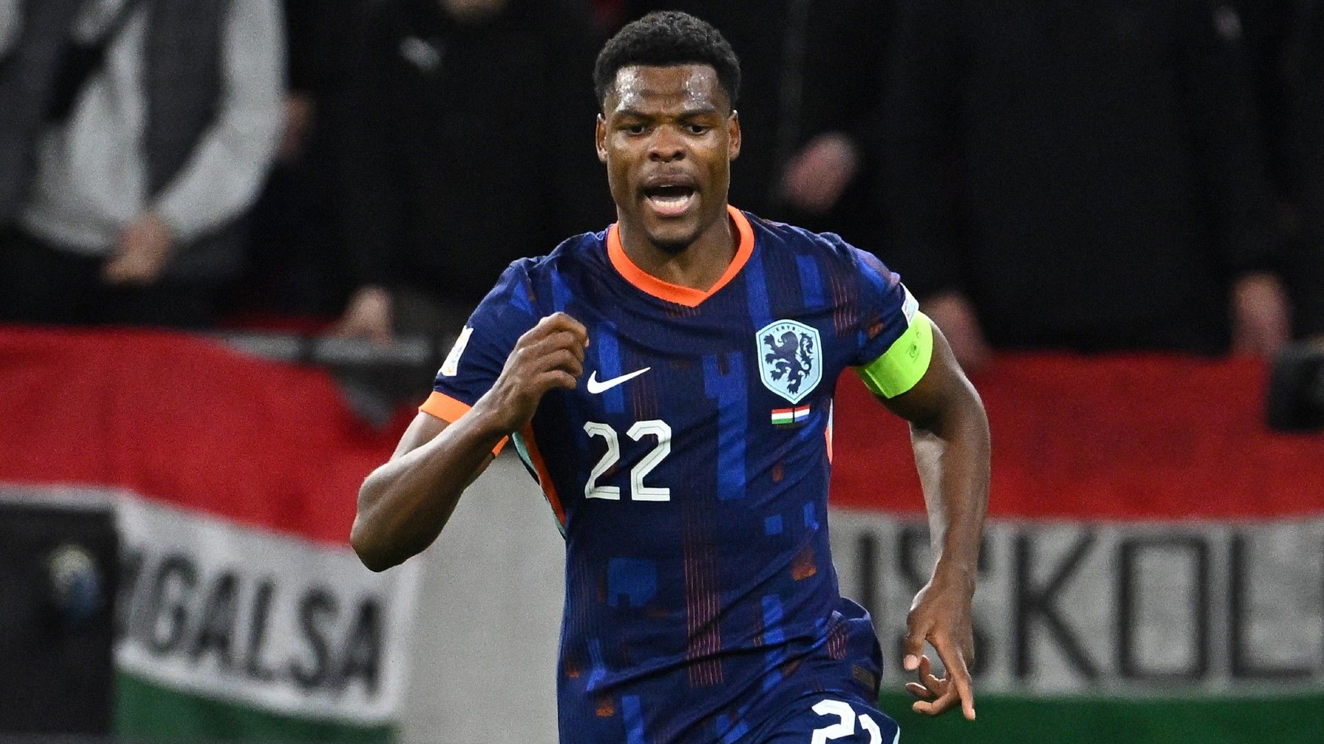 Netherlands' defender #22 Denzel Dumfries celebrates scoring the 1-1