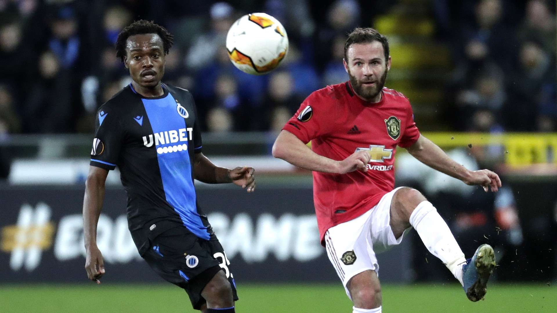 Percy Tau of Brugge (L) in action against Juan Mata of Manchester United (R), February 2020