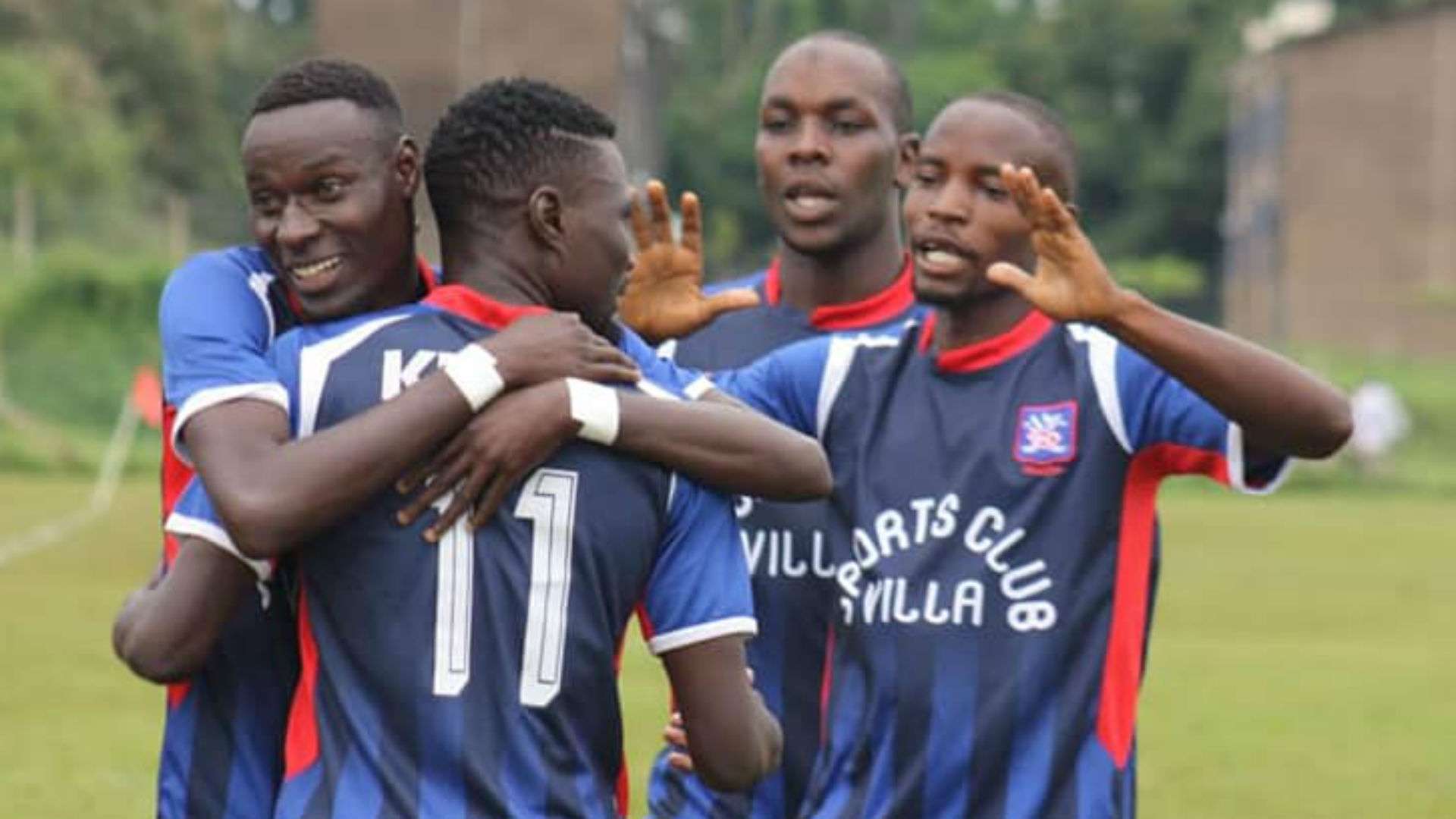 Emmanuel Kalyoya and SC Villa players