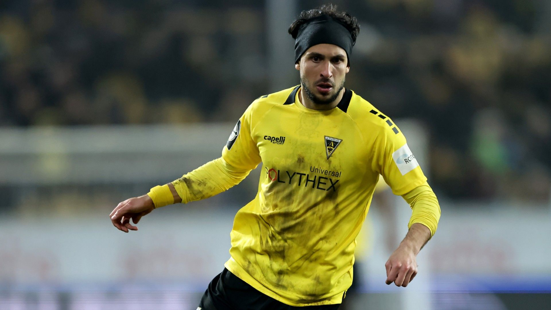 Anas Bakhat of Alemannia Aachen runs with the ball 