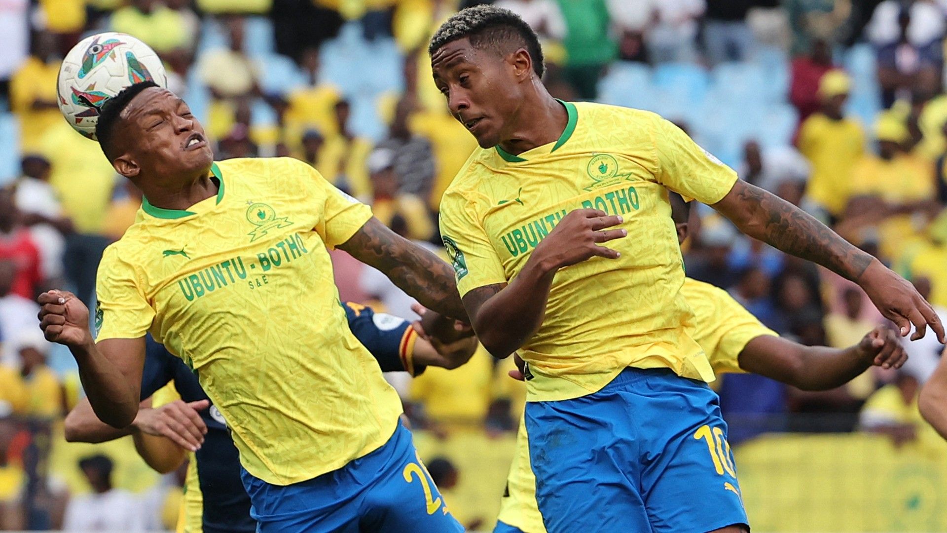  Sundowns' South African defender #20 Grant Kekana heads the ball