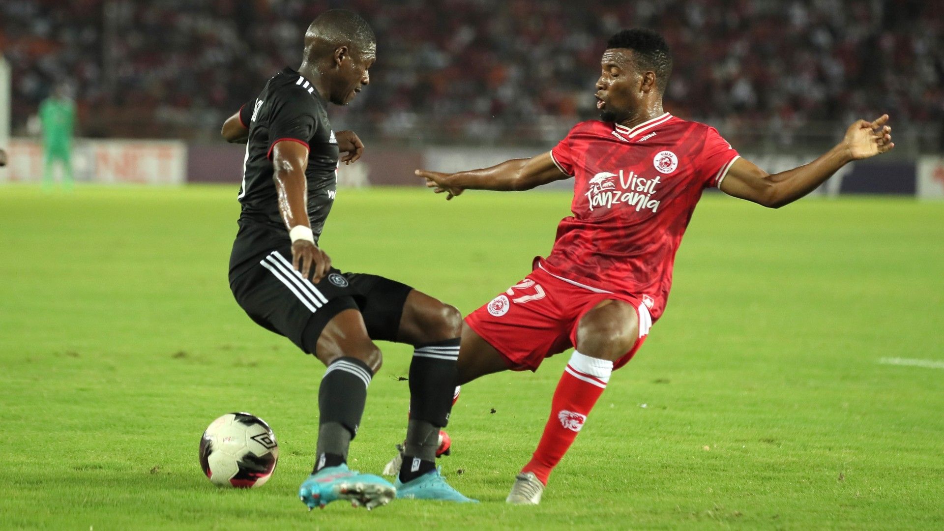 Ntuthuko Mabaso of Orlando Pirates challenged by Yusufu Mhilu of Simba