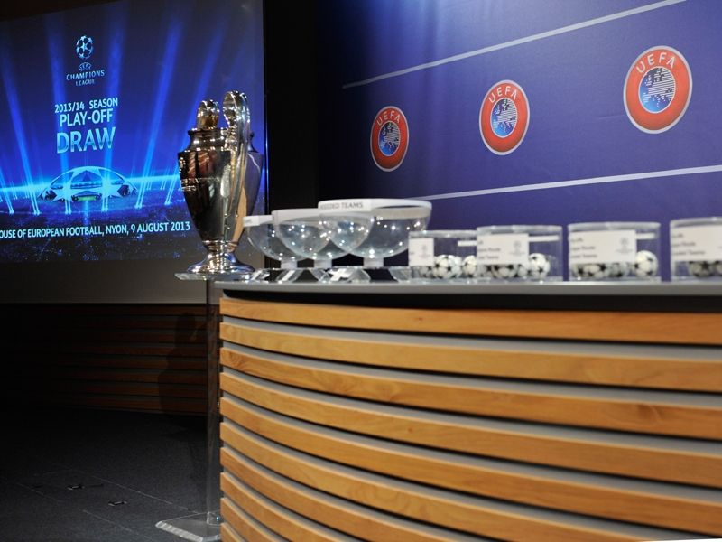 The UEFA Champions League trophy and draw balls are displayed prior to the UEFA Champions League 2013/14 Season Play-Off