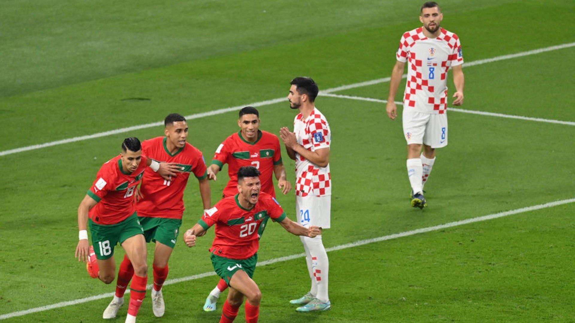 Achraf Dari leads Morocco's celebrations. 