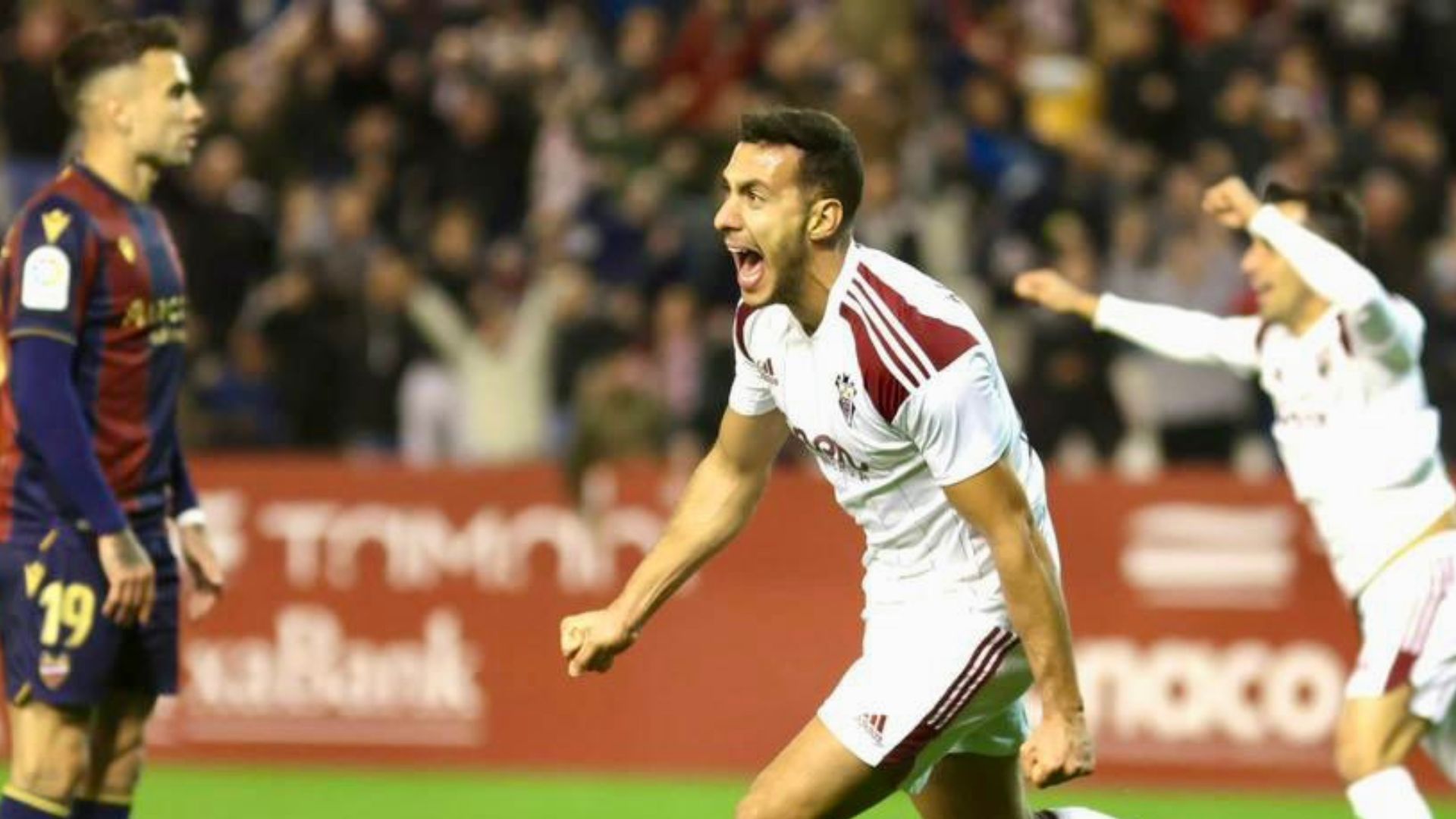 Jugadores, celebrando un gol