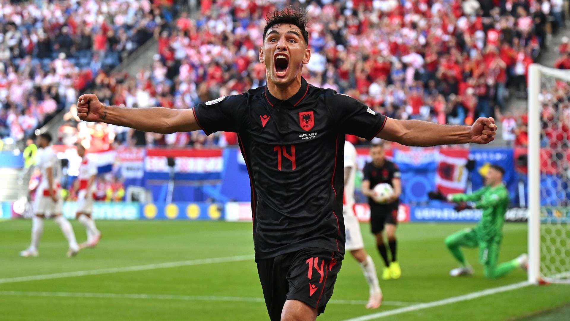 Qazim Laci of Albania celebrates scoring