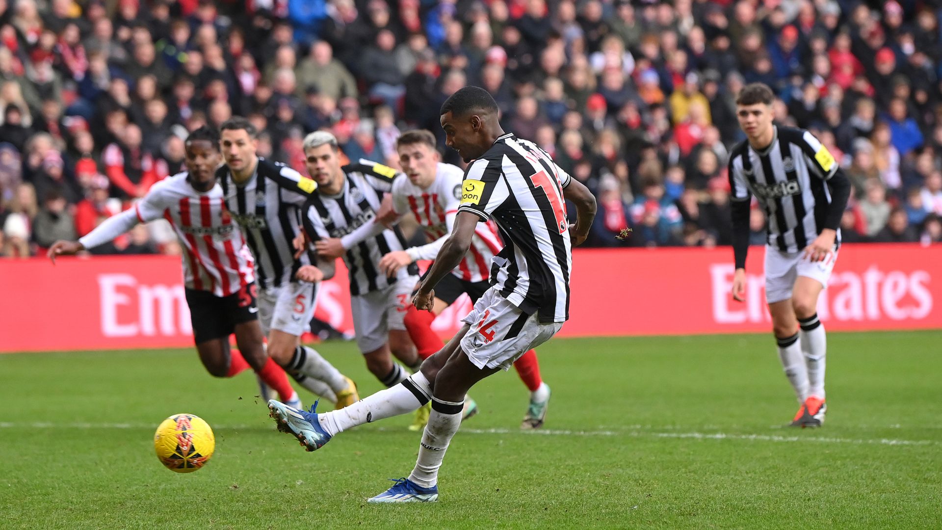 Newcastle player Alexander Isak scores the third goal from the penalty spot