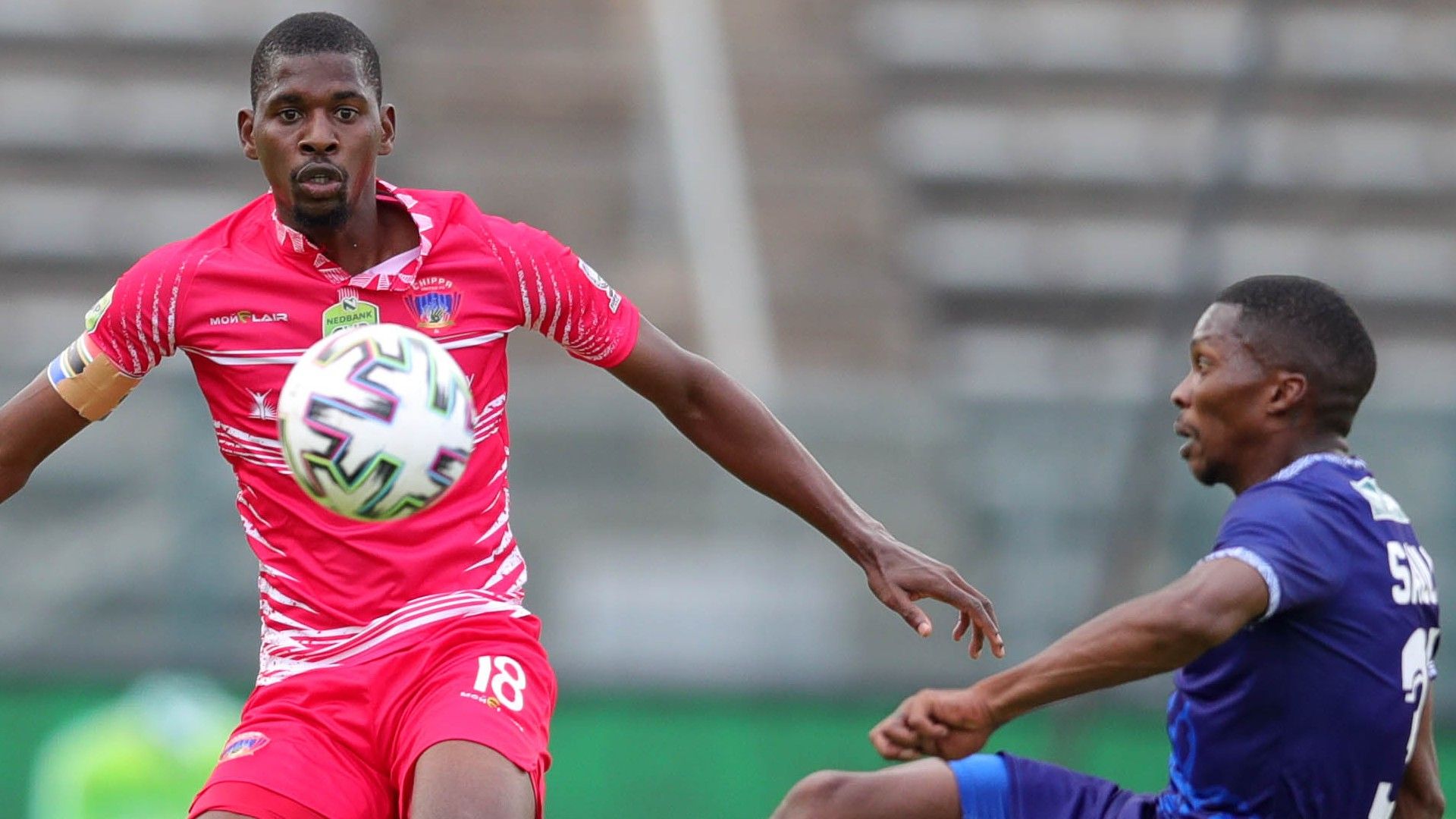 Joshua Sauls of Pretoria Callies challenged by Sandile Mthethwa of Chippa United, April 2021
