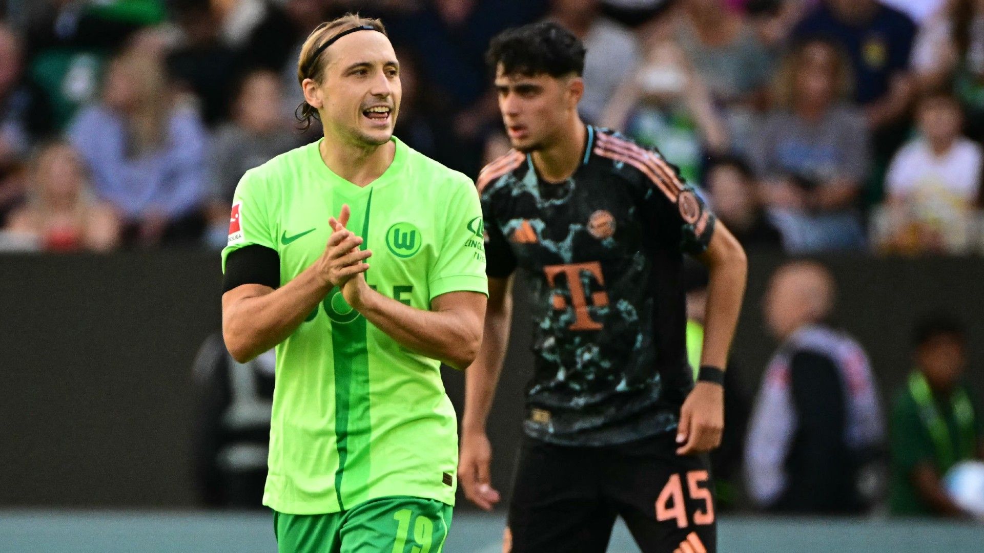 Wolfsburg's Croatian midfielder #19 Lovro Majer celebrates after scoring a penalty