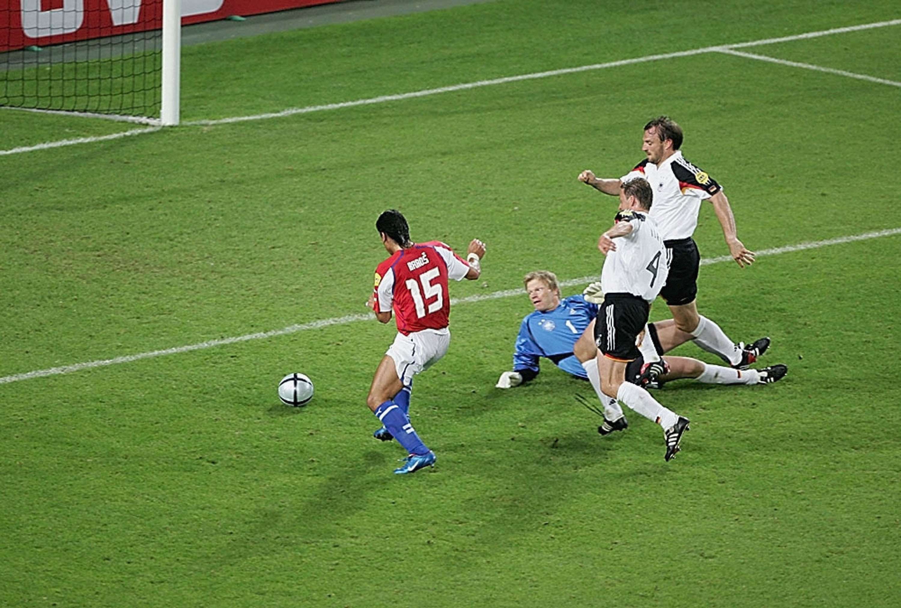 Milan Baros of Czech Republic goes around Germany's Oliver Kahn