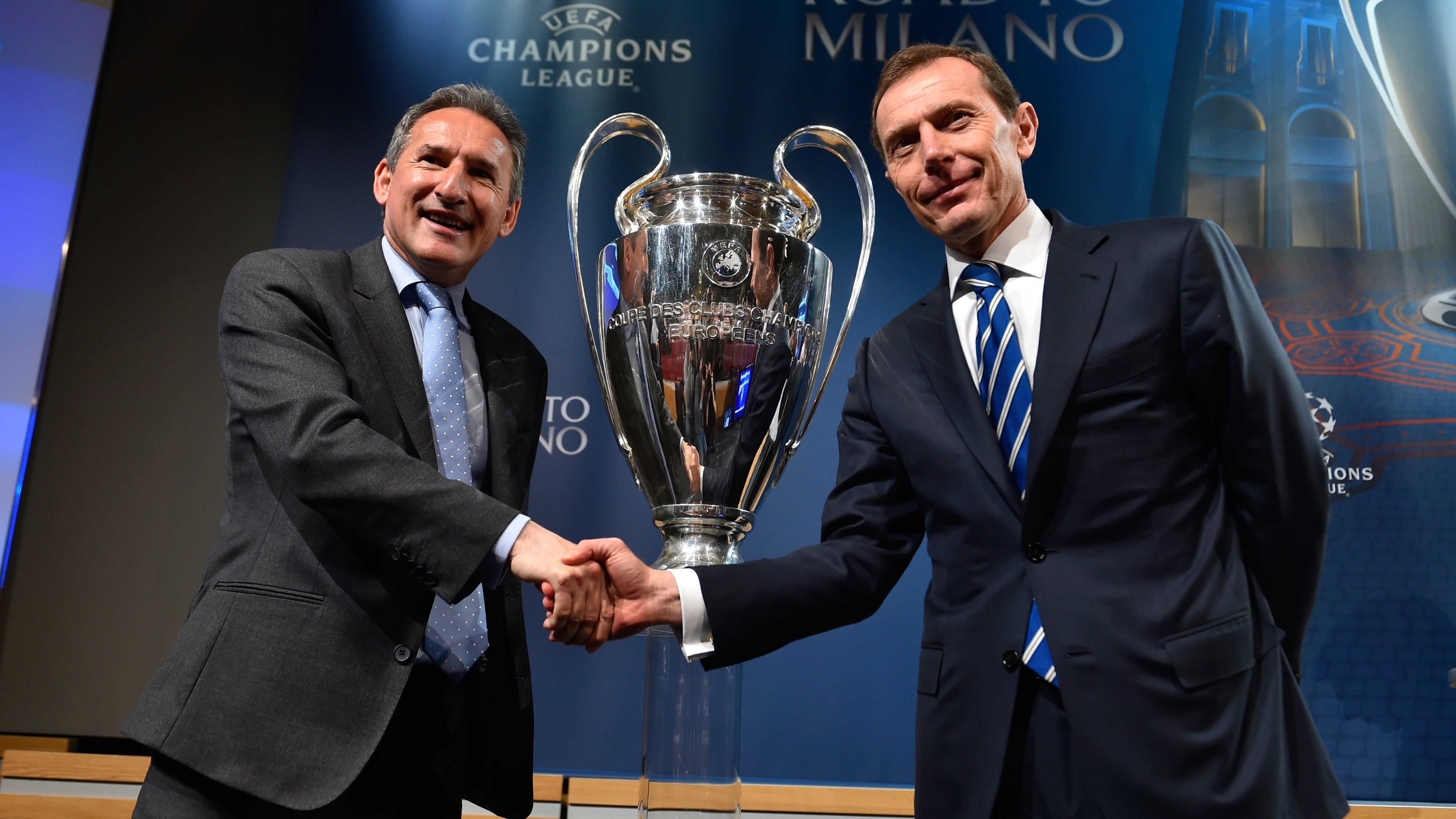 Emilio Butragueno (R) shakes hands with Manchester City football director Txiki Begiristain
