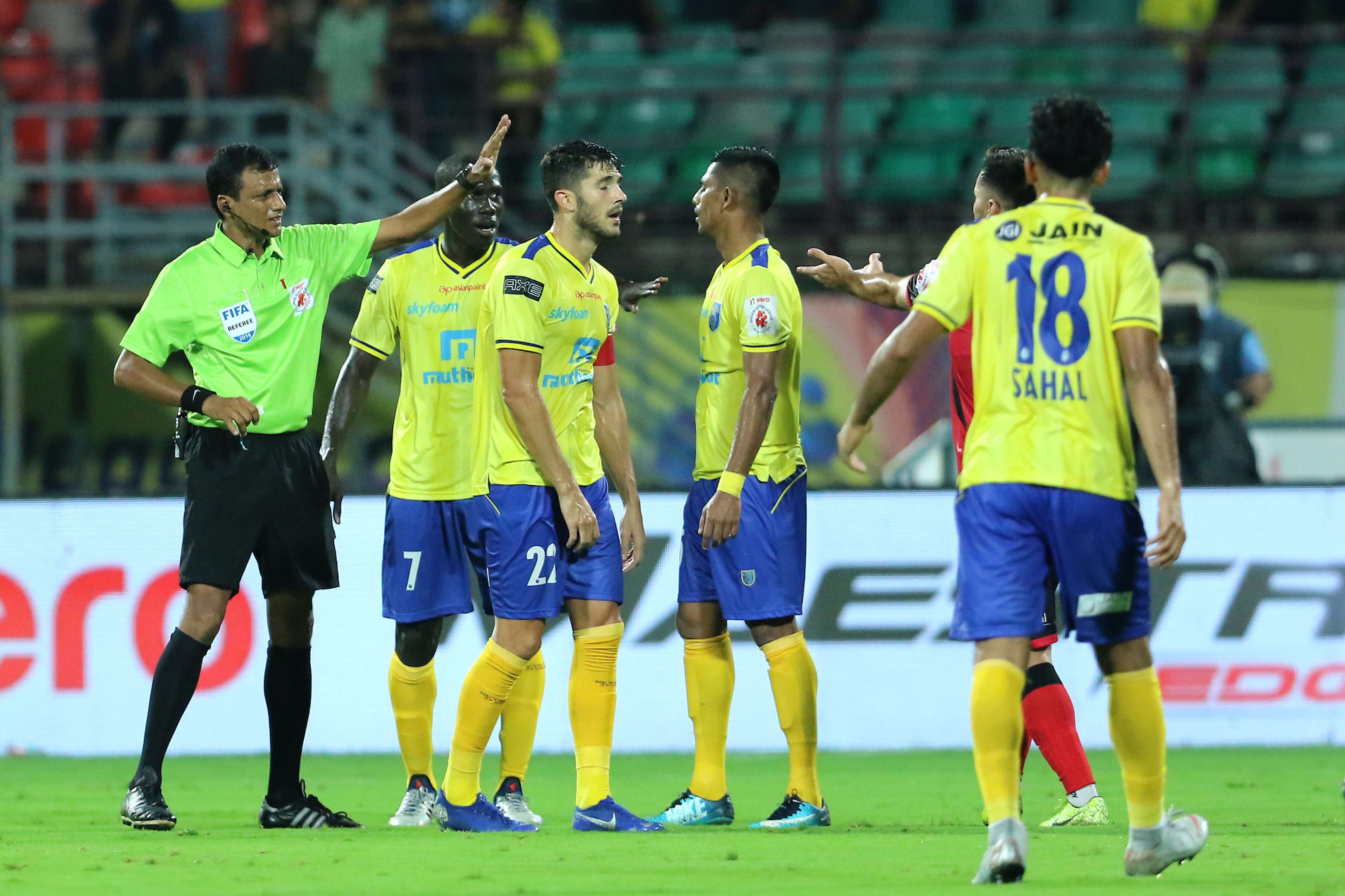 Kerala Blasters FC players argue with the Referee