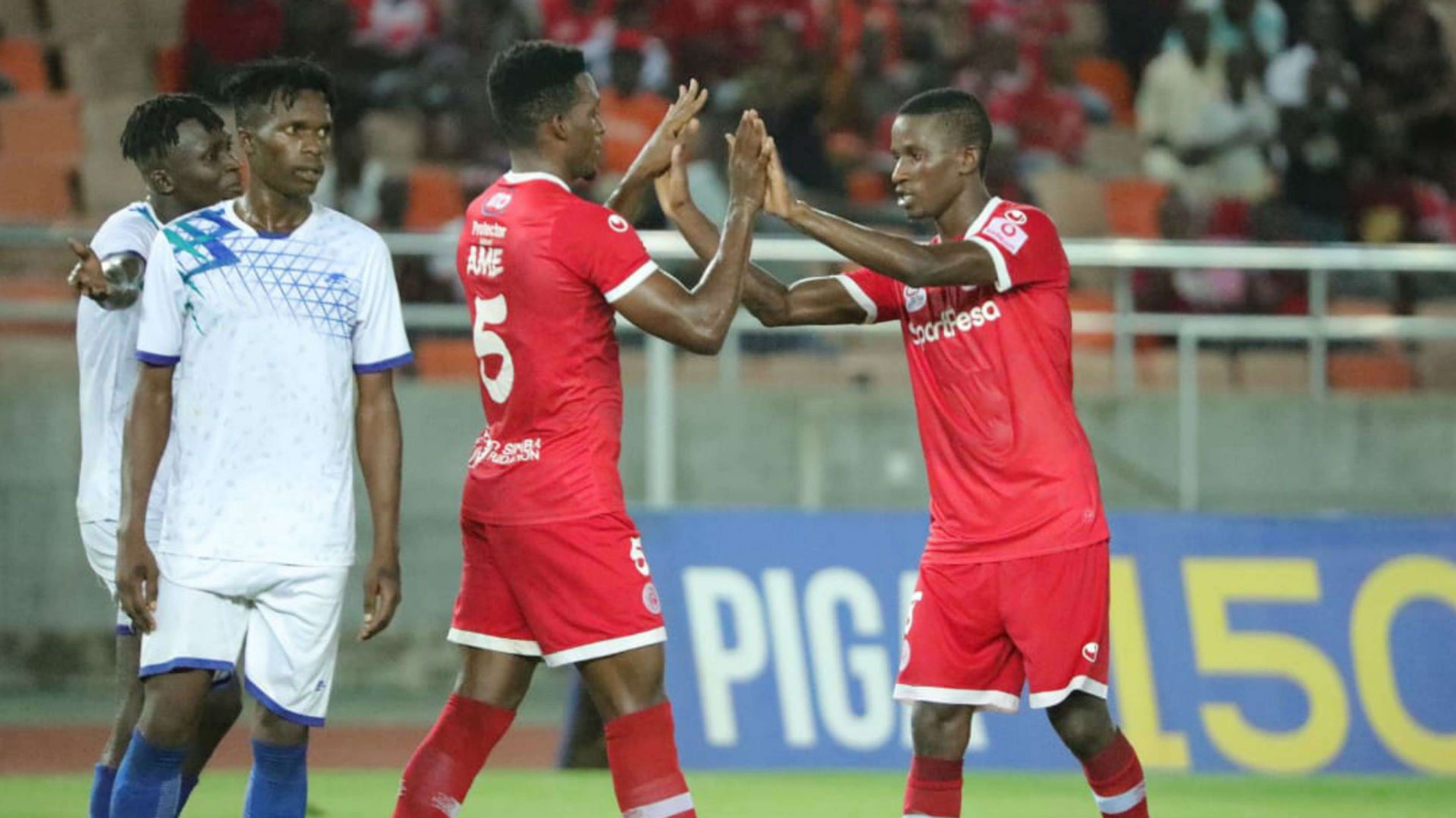 Ibrahim Ame and Chris Mugalu of Simba vs Maji Maji FC.