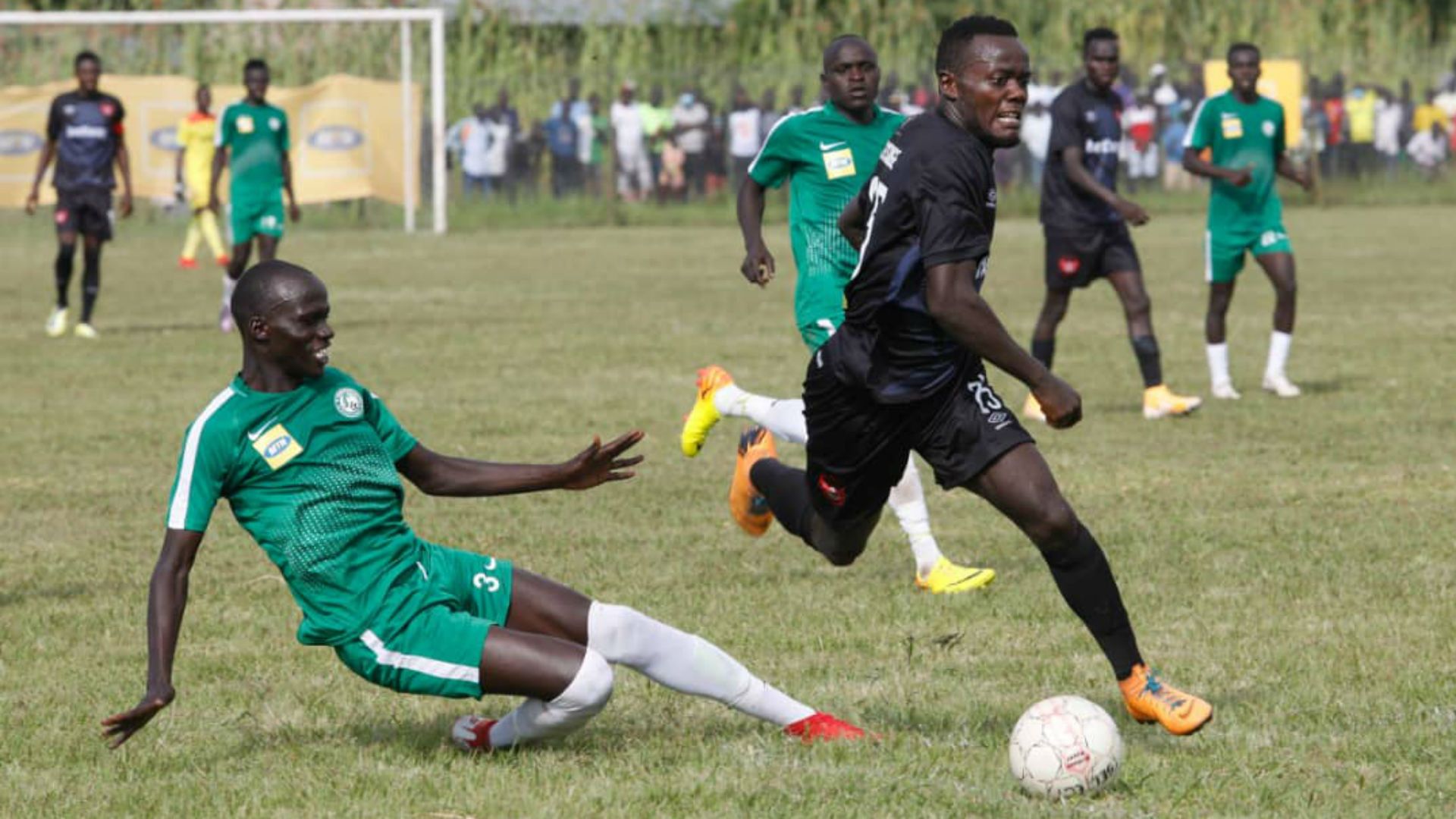 Express FC Charles Musiige dribbles past the Onduparaka FC midfield.