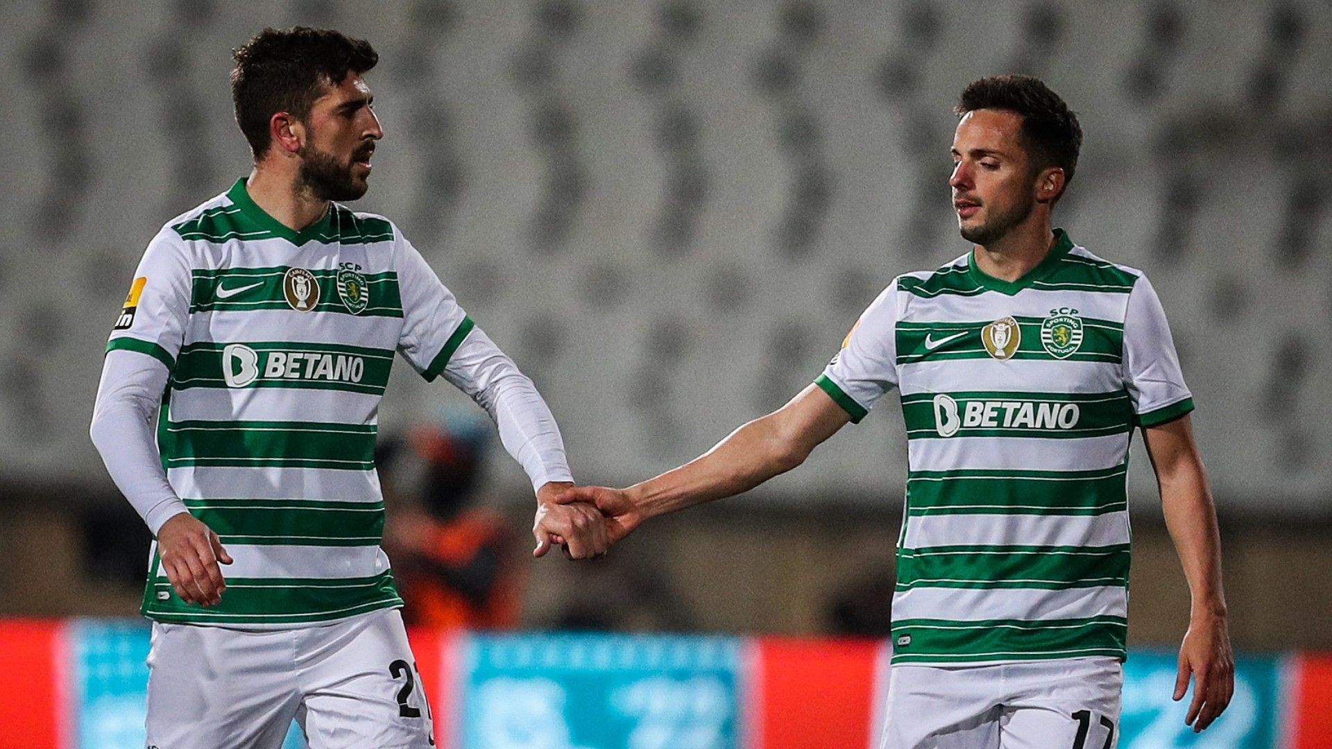 Sporting's Portuguese forward Paulinho (L) celebrates with Sporting's Spanish midfielder Pablo Sarabia