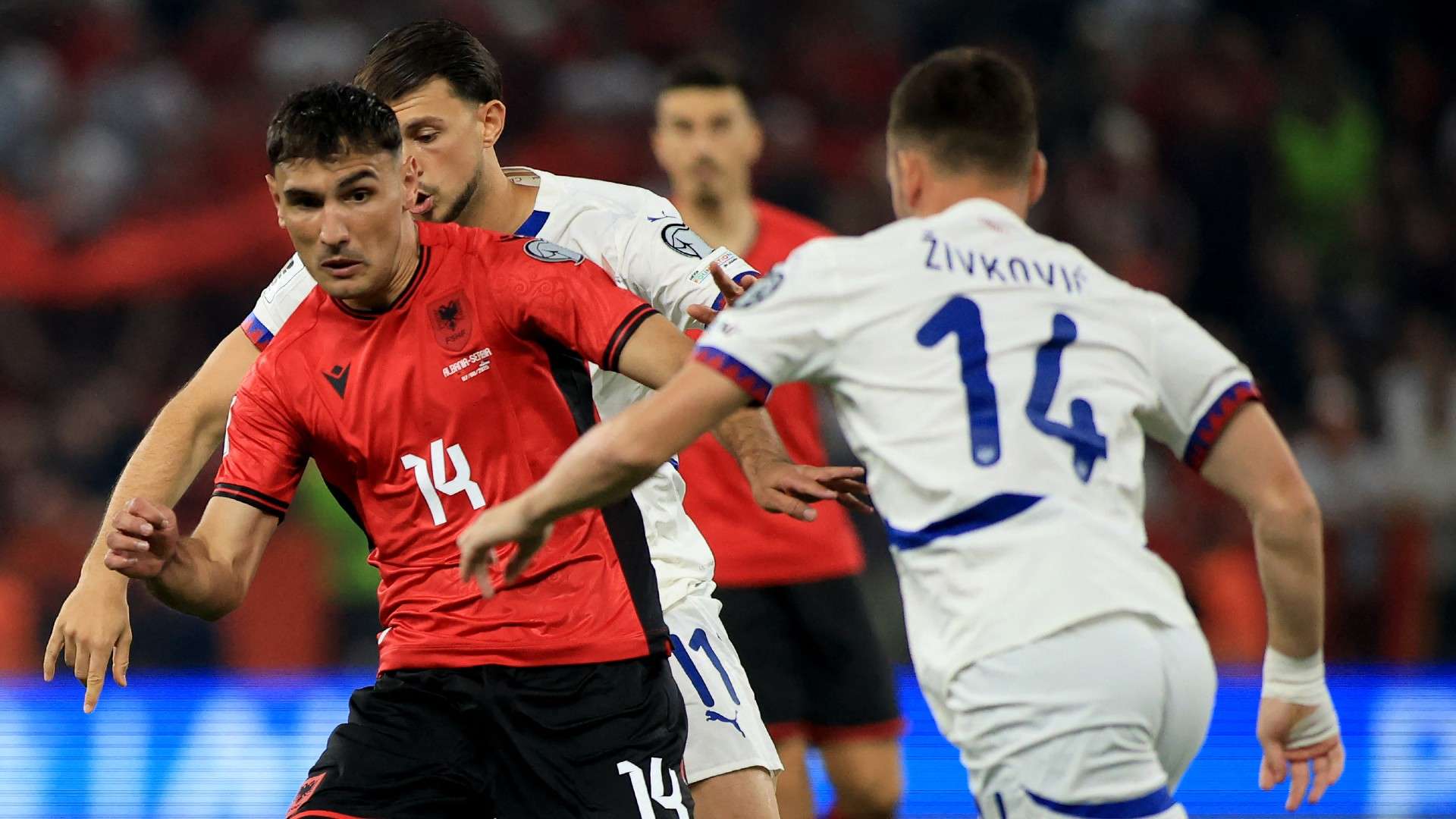 Albania's midfielder #14 Qazim Laci (C) fights for the ball with Serbia's midfielder #14 Andrija Zivkovic (L) and Serbia's midfielder #11 Lazar Vujadin Samardzic
