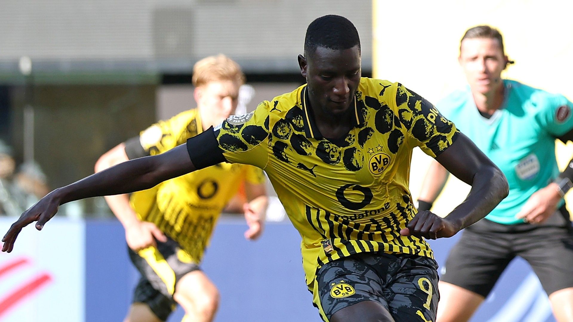 Serhou Guirassy #9 of Borussia Dortmund scores his team's second goal