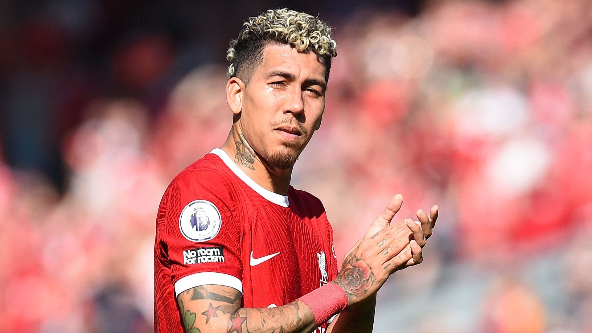 Roberto Firmino in tears and is consoled by Liverpool team-mates 