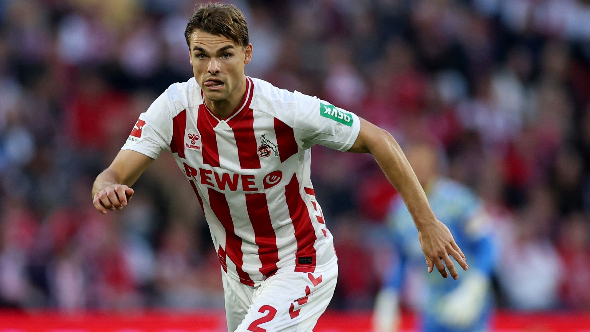 Joel Schmied of 1.FC Koln runs with the ball 