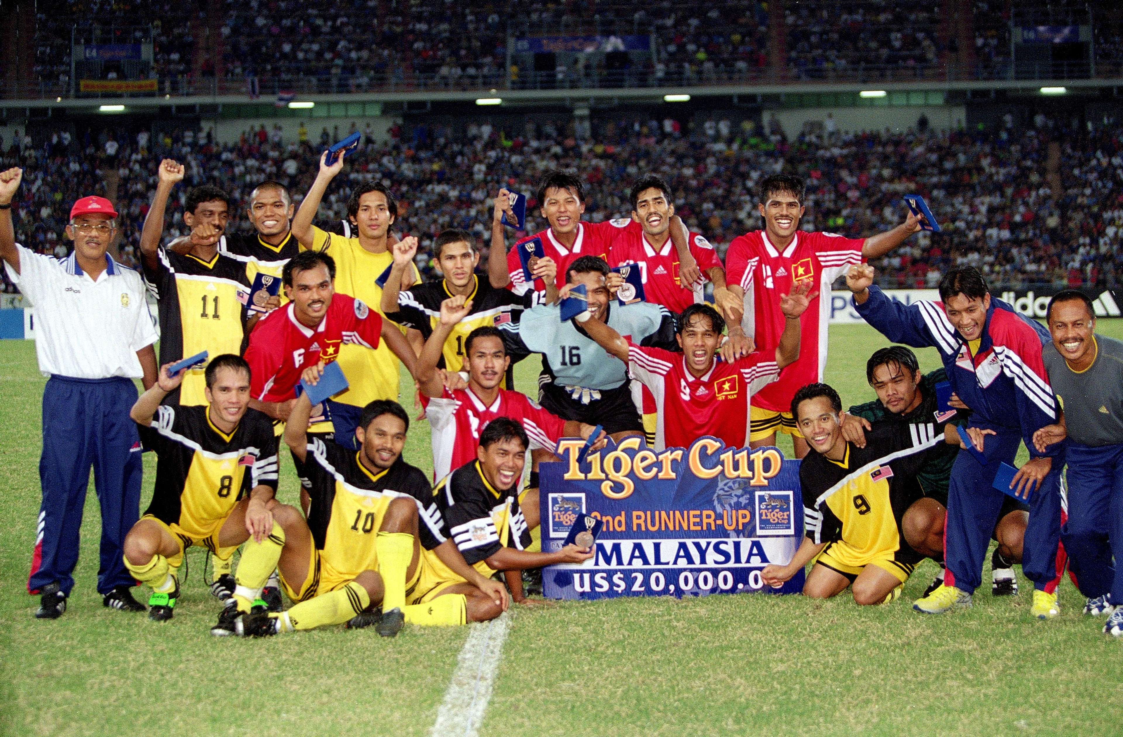 Malaysia team celebrating finishing third in the 2000 AFF Cup