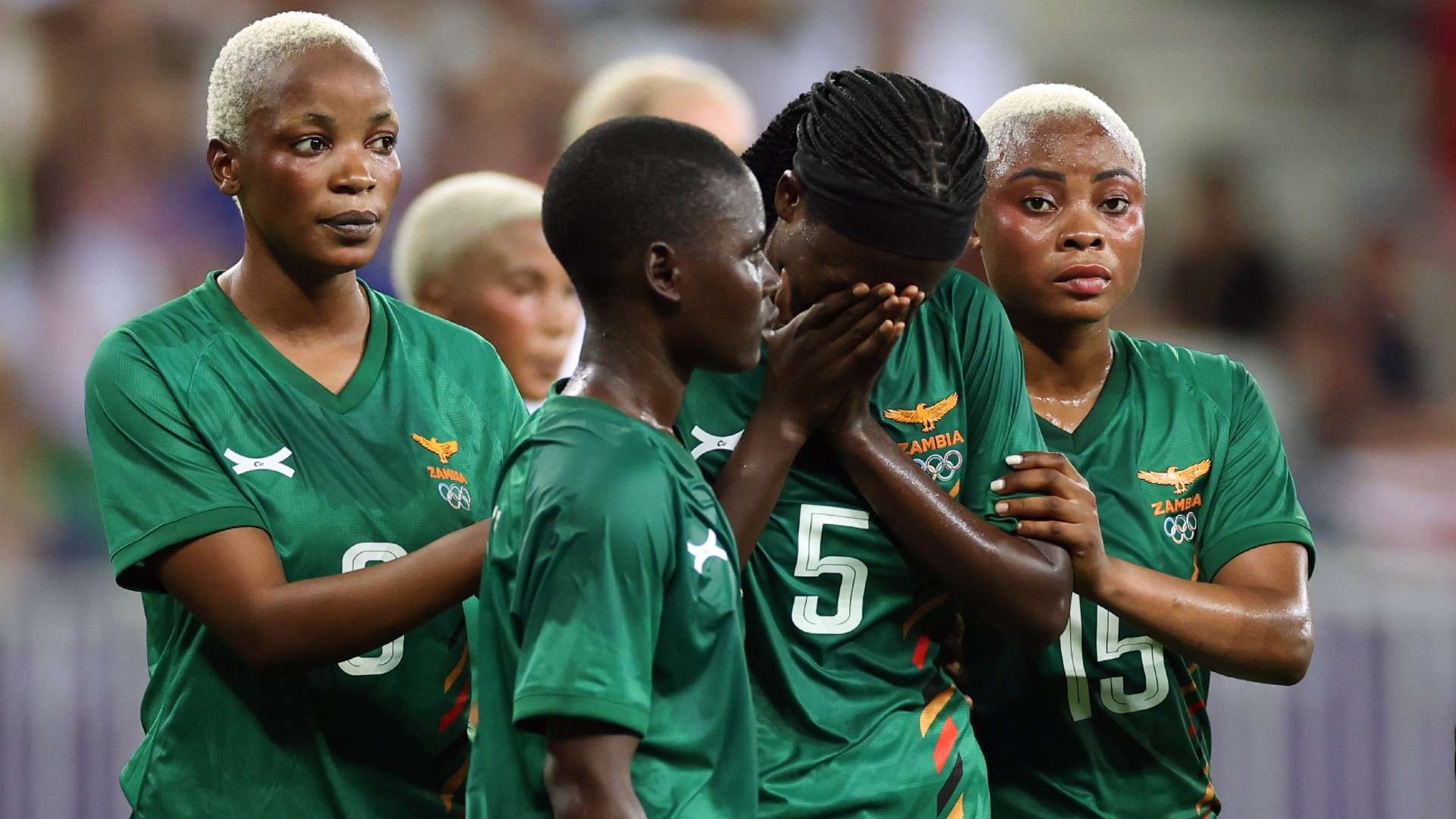 Pauline Zulu of Team Zambia #5 reacts among team mate