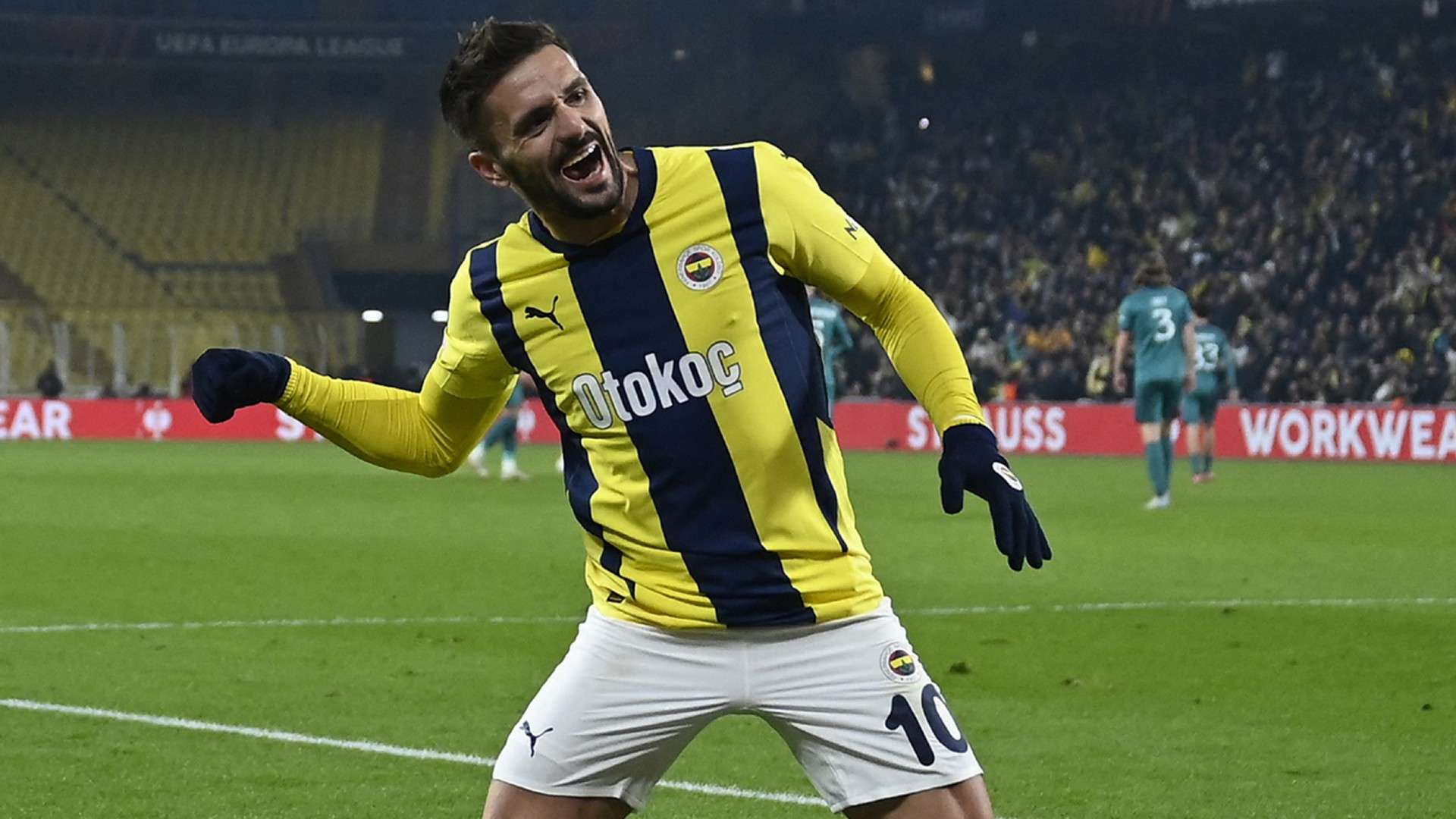 Fenerbahce's Serbian midfielder #10 Dusan Tadic (R) celebrates after scoring a goal