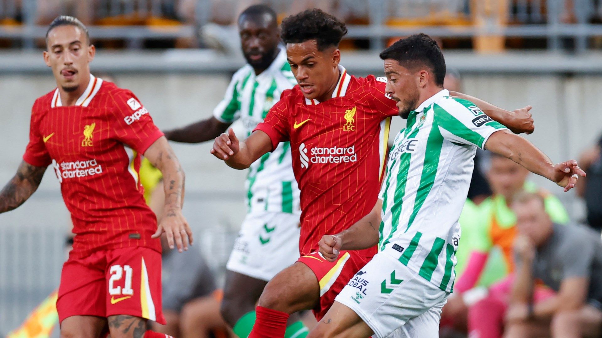 Liverpool's Fabio Carvalho battles for possession with Real Betis' Pablo Fornals 2024-25