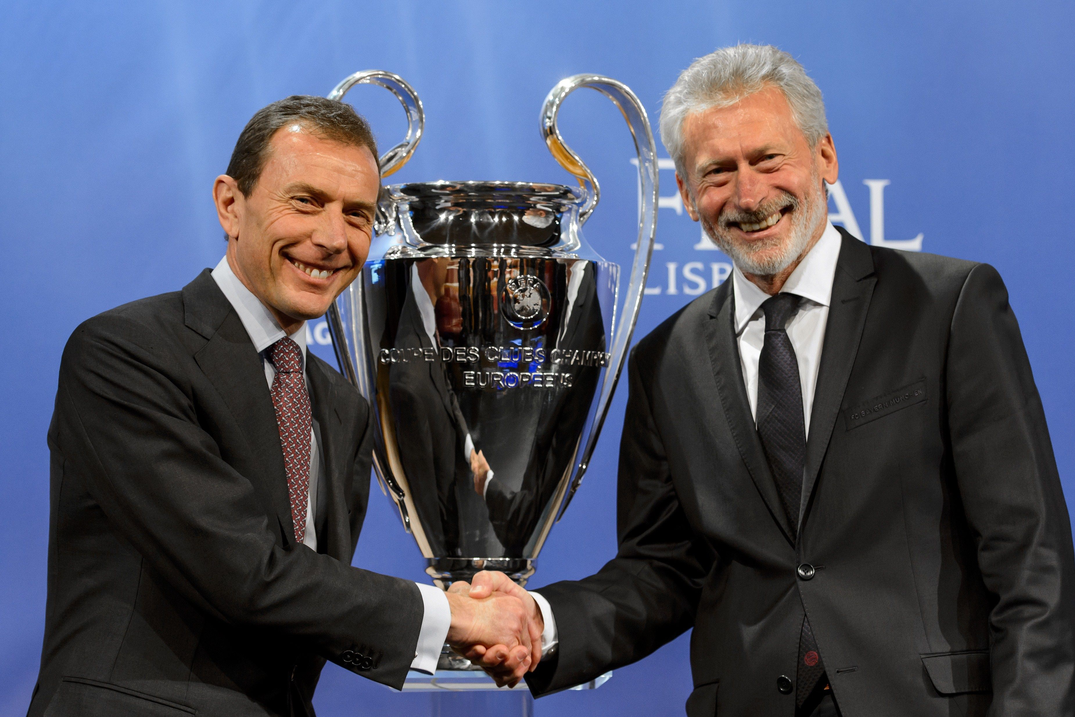 Bayern head scout Paul Breitner (R) with Emilio Butragueno