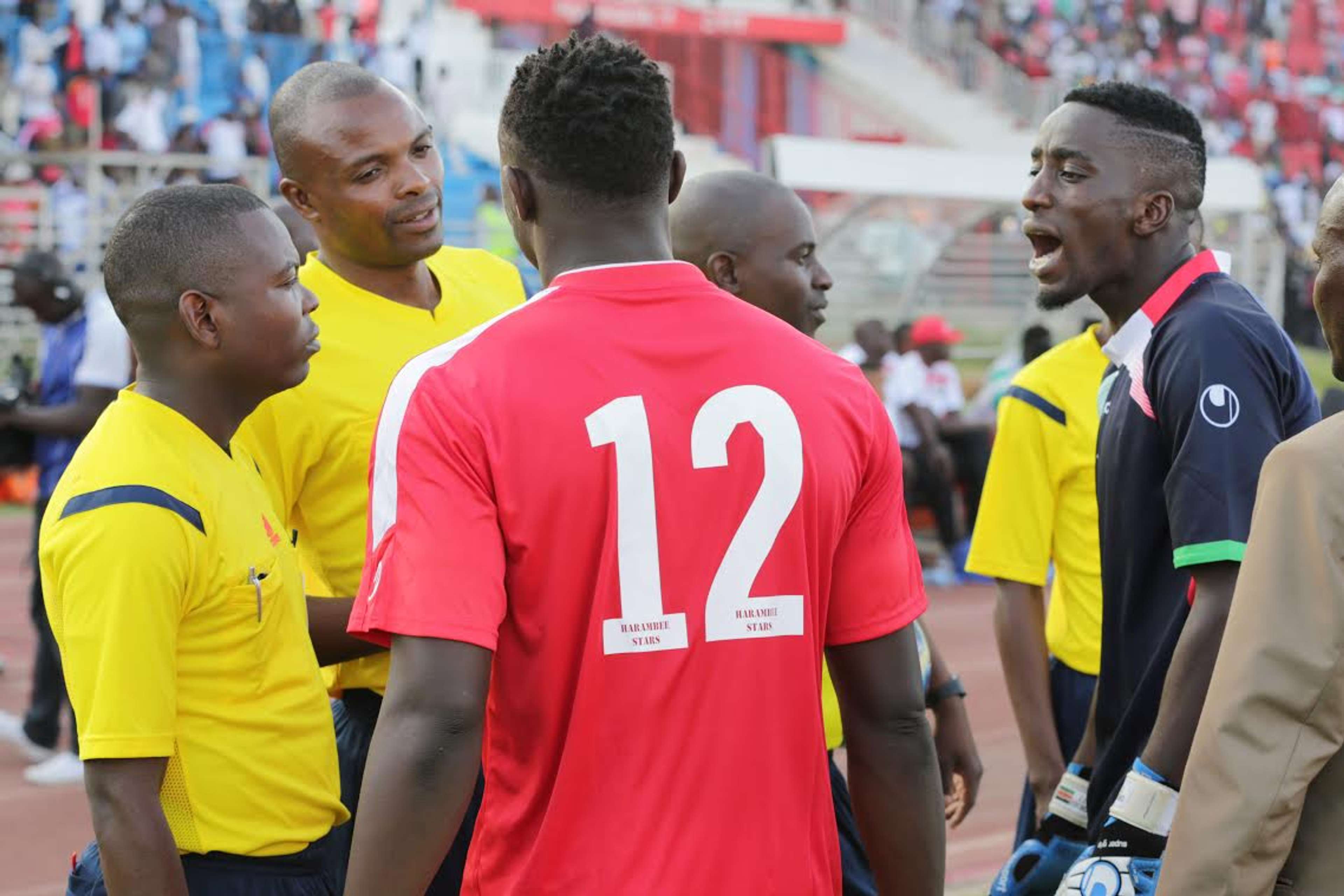 Kenya captain Victor Wanyama and goalie Arnold Origi argue with match officials