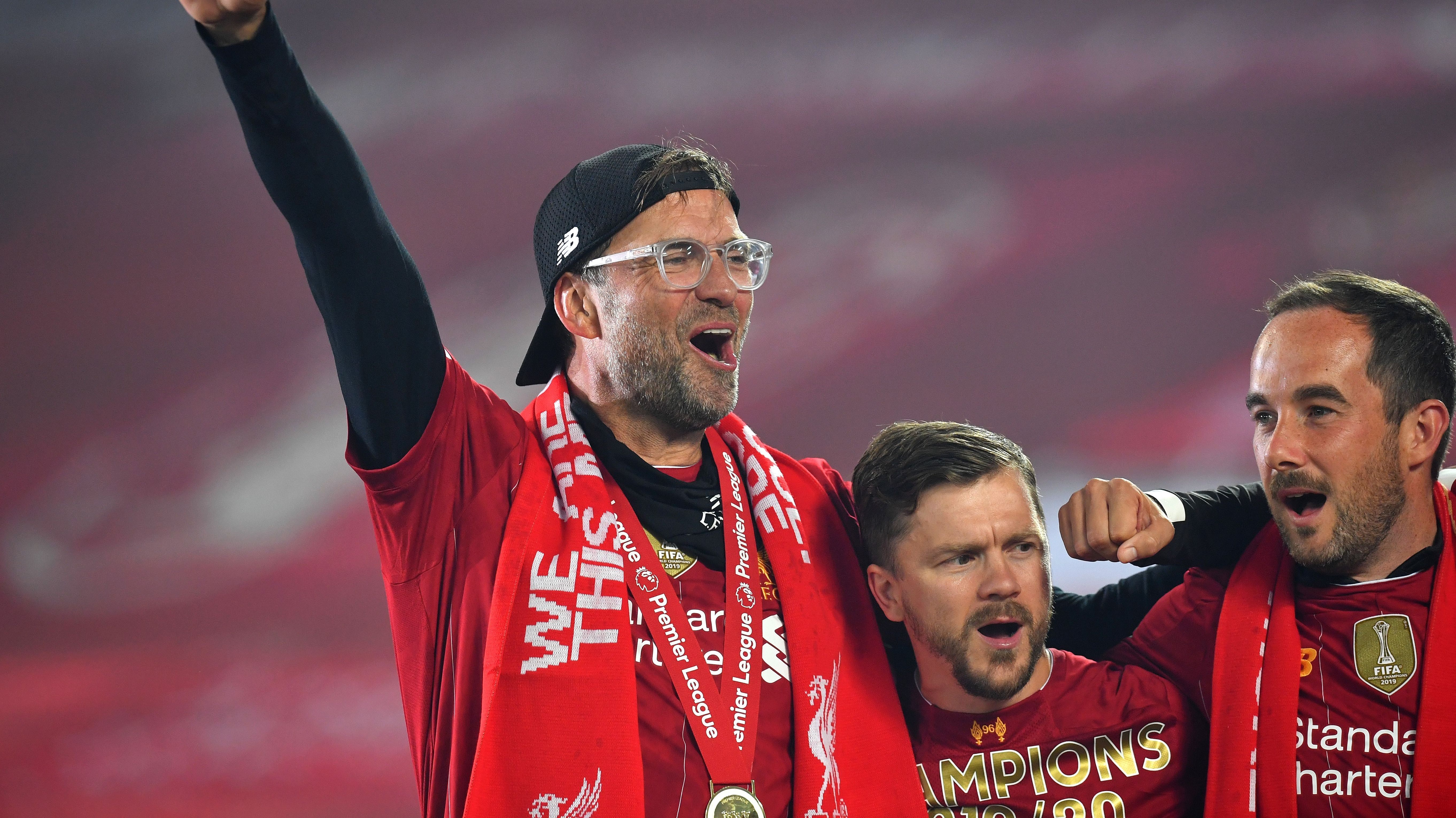 Liverpool lifts The Premier League trophy following the Premier League match between Liverpool FC and Chelsea FC at Anfield on July 22, 2020