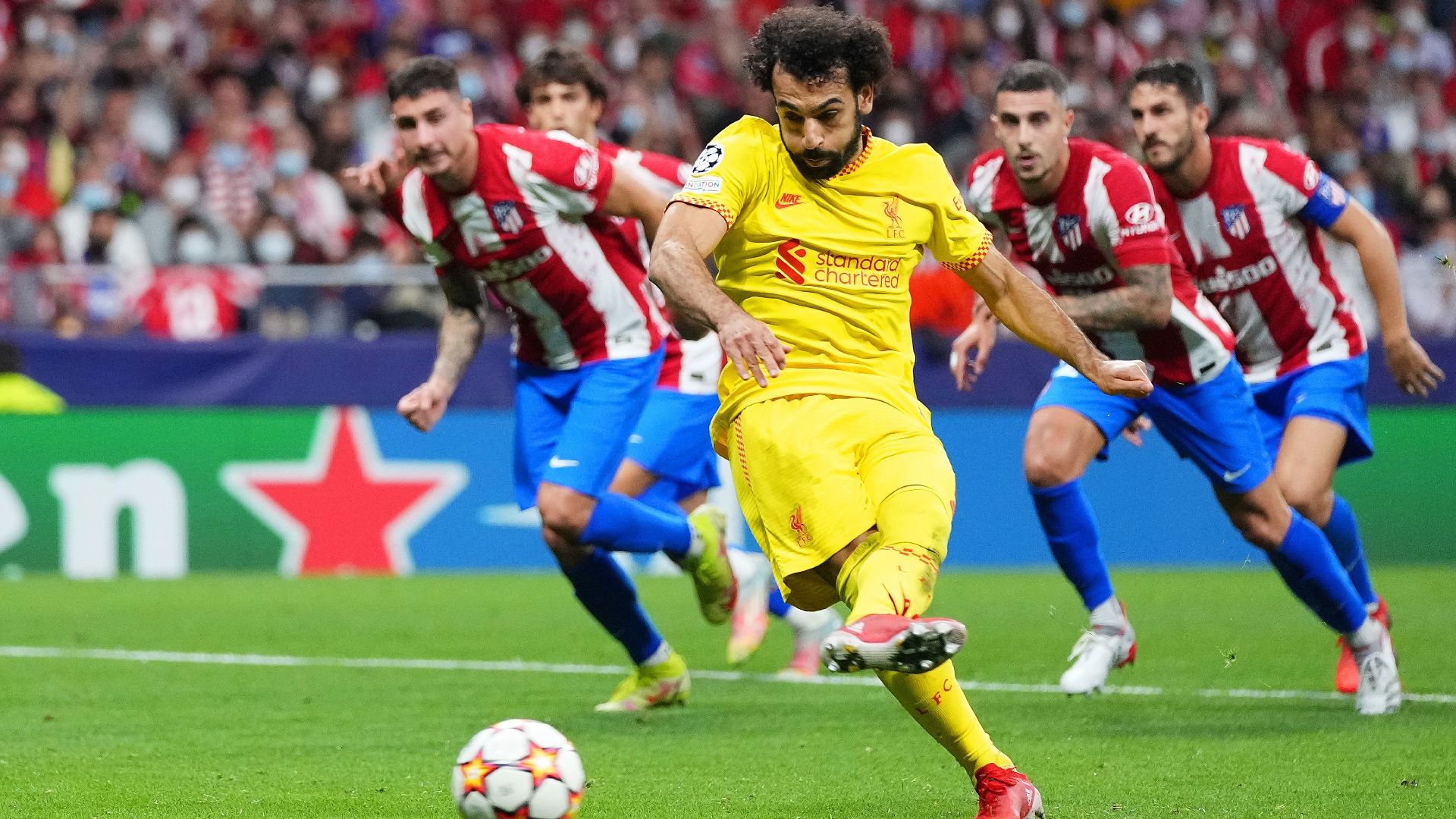 Mohamed Salah scores a penalty for Liverpool against Atletico Madrid in 2021-22