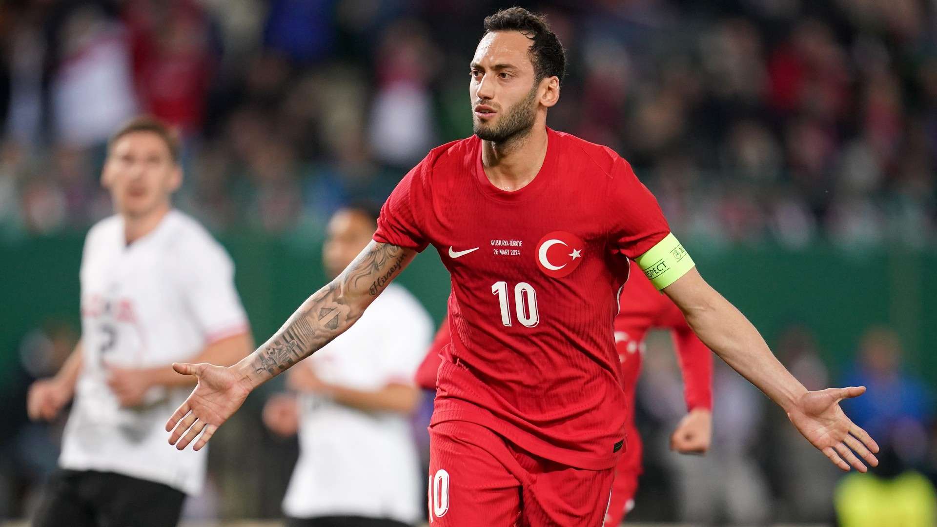 Hakan Calhanoglu of Turkey celebrates scoring