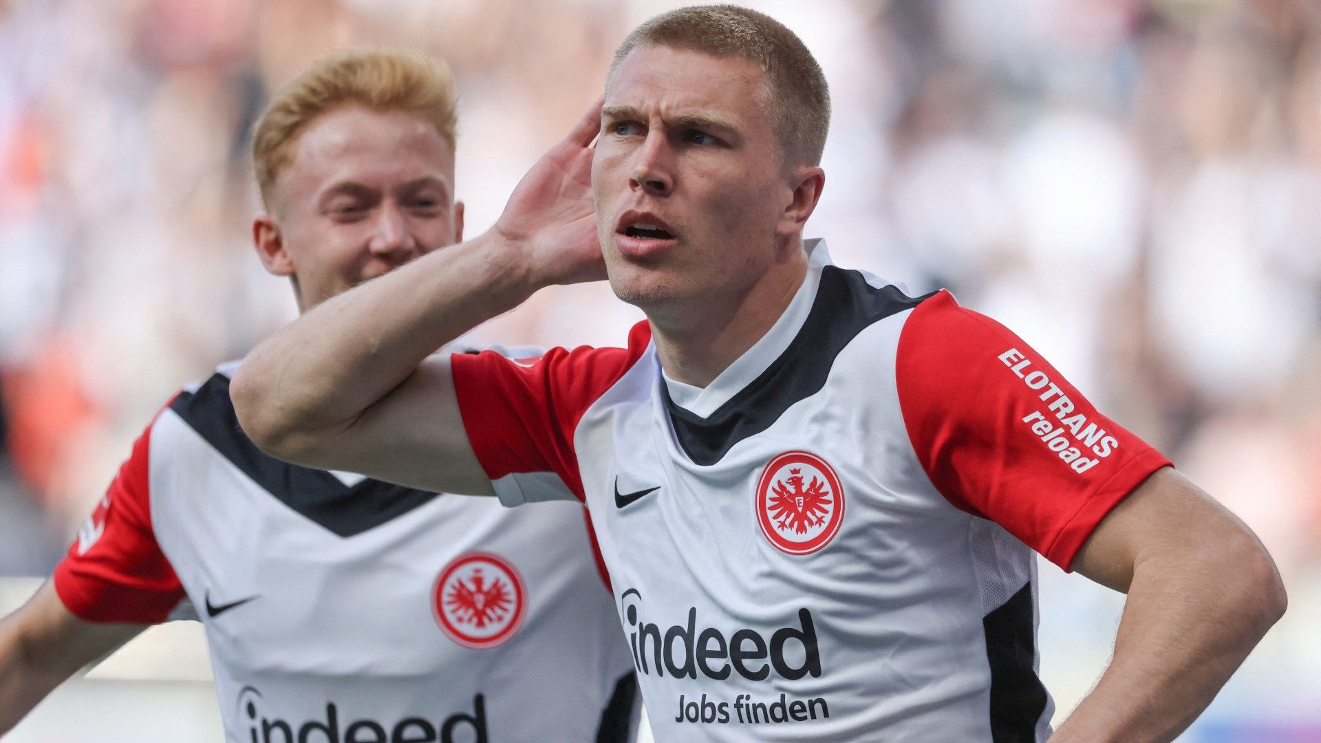 Frankfurt's Danish defender #13 Rasmus Kristensen (R) celebrates scoring the opening goal 