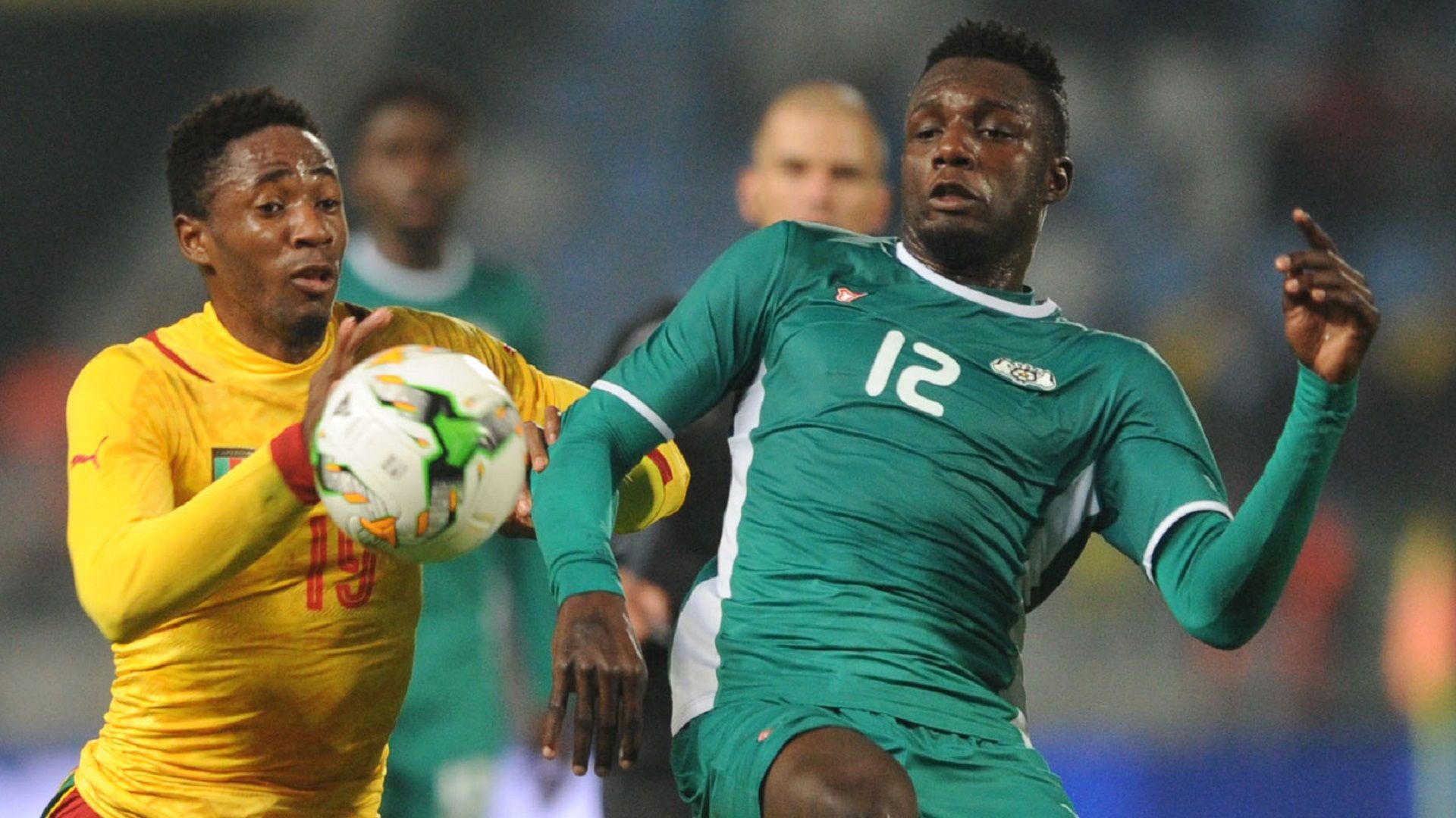 Raphael Eric Messi Bouli of Cameroon and Abdoul Abass Guiro of Burkina Faso