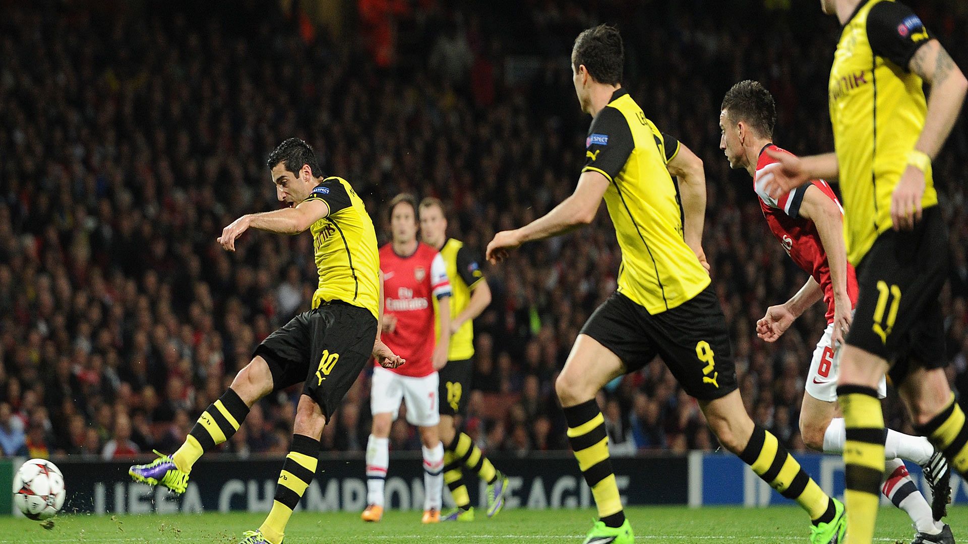 Henrikh Mkhitaryan scores against Arsenal