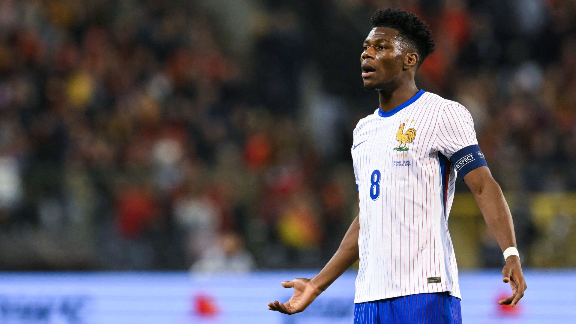 France's midfielder #08 Aurelien Tchouameni reacts