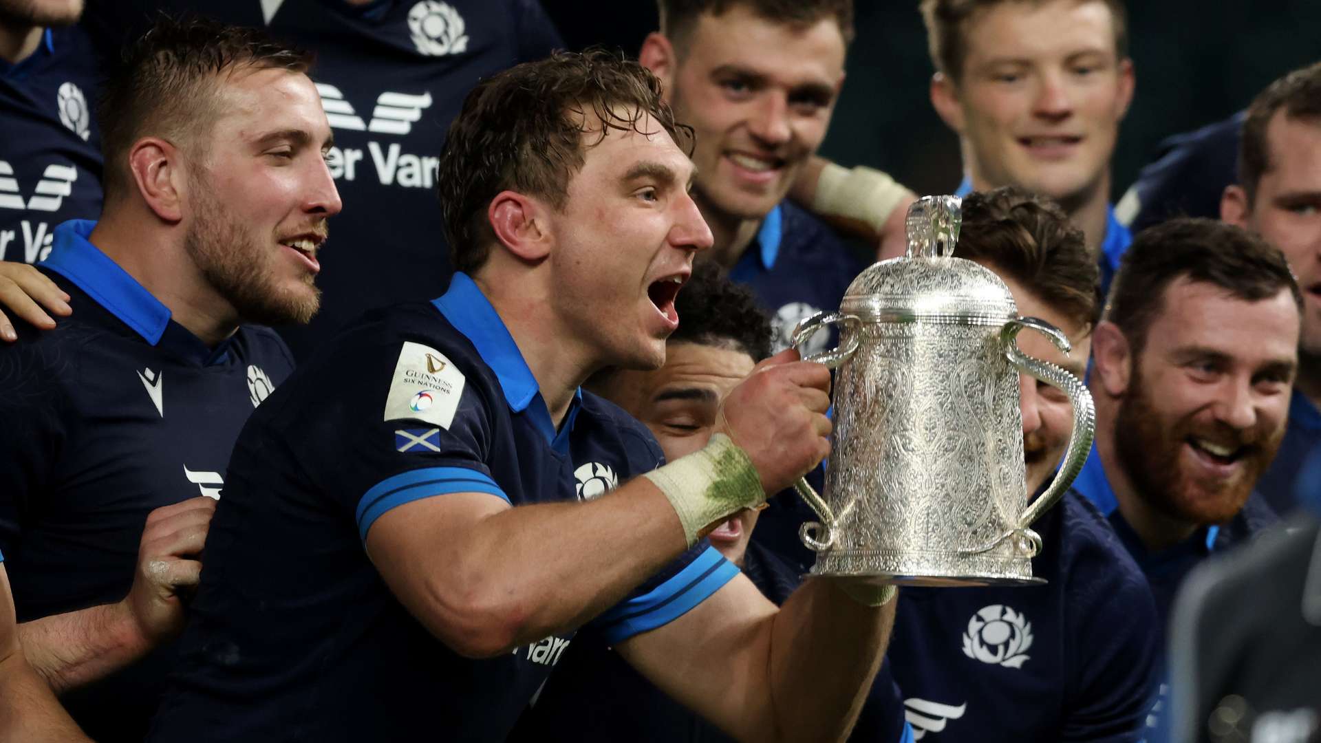 Scotland celebrates with the Calcutta Cup trophy