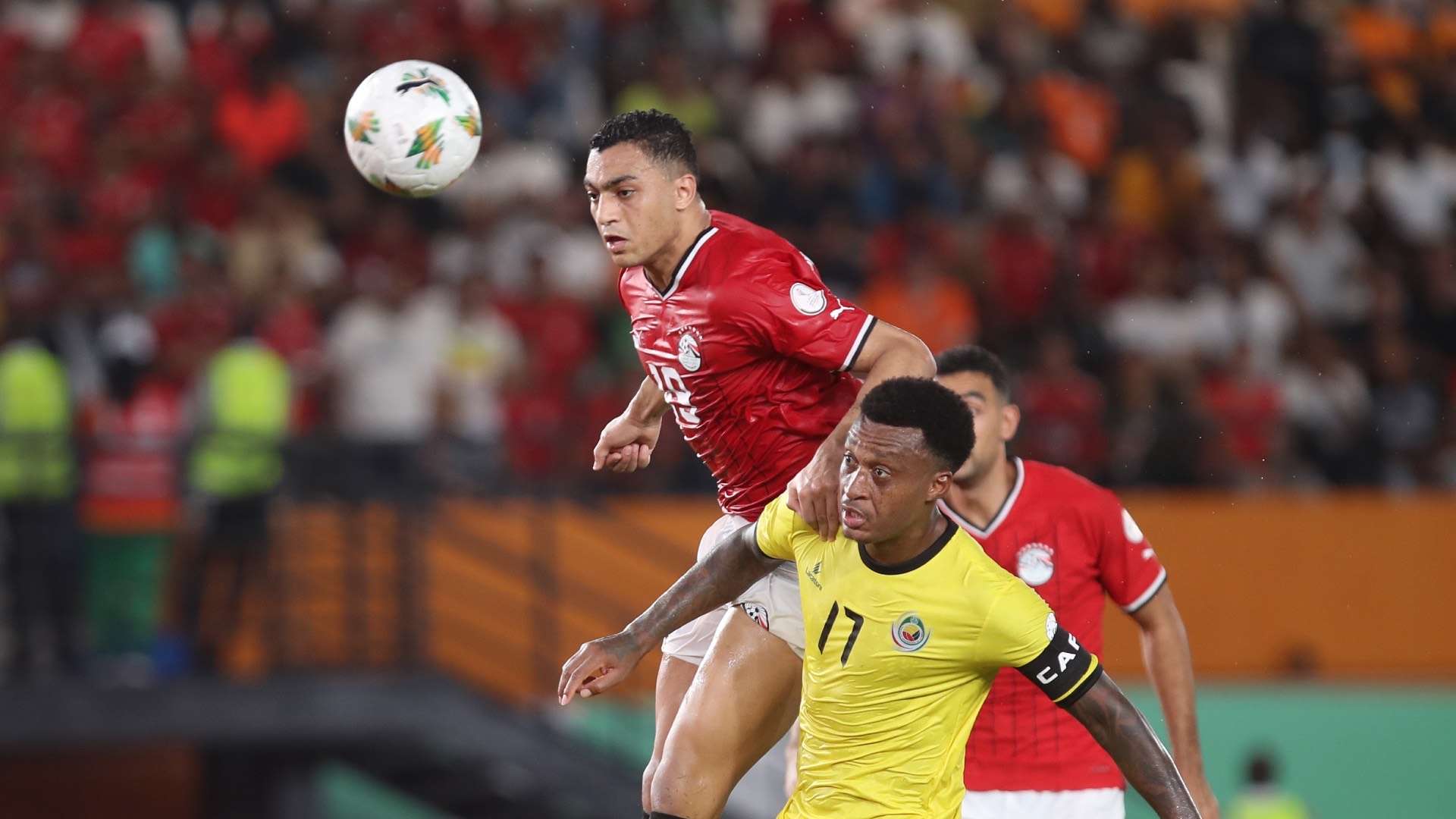 Mostafa Mohamed of Egypt challenges Edson Andre Sitoe of Mozambique during the 2023 Africa Cup of Nations match between Egypt and Mozambique.