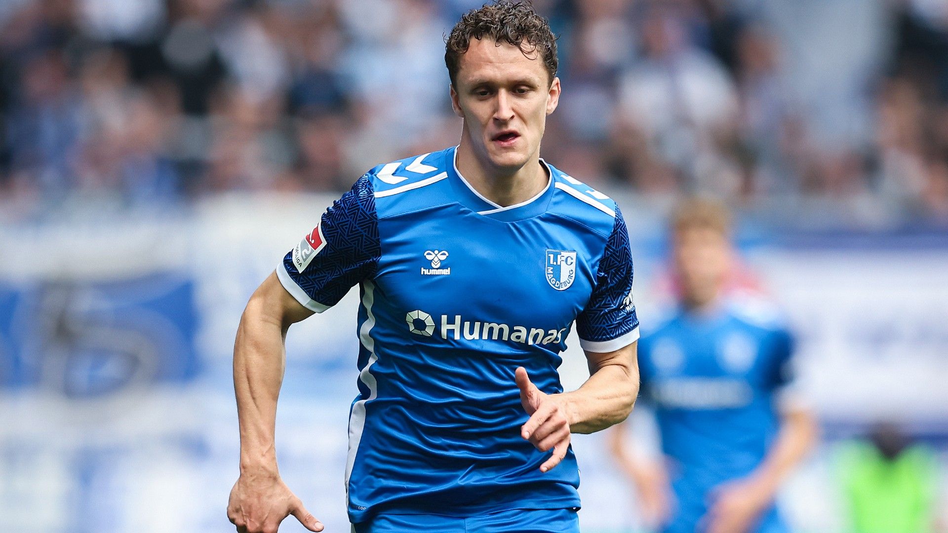 Martijn Kaars of Magdeburg plays the ball 