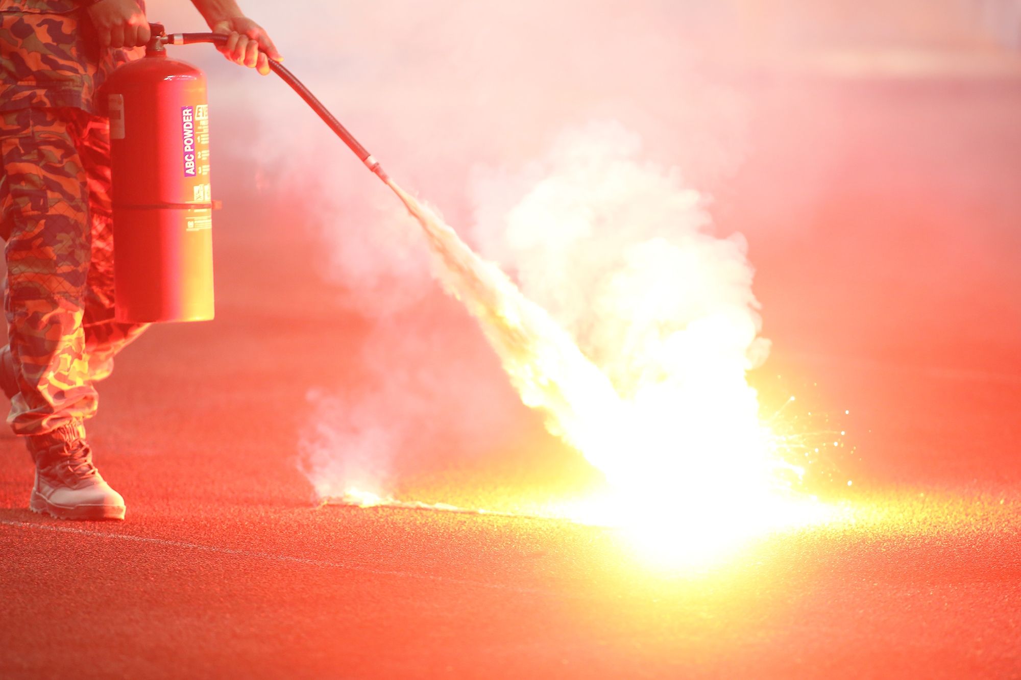Flares were thrown into the pitch, putting even the players and officials in danger