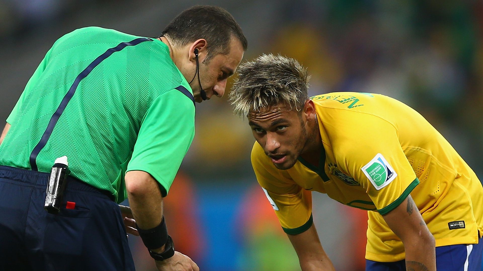 Turkish referee Cuneyt Cakir with Nyemar