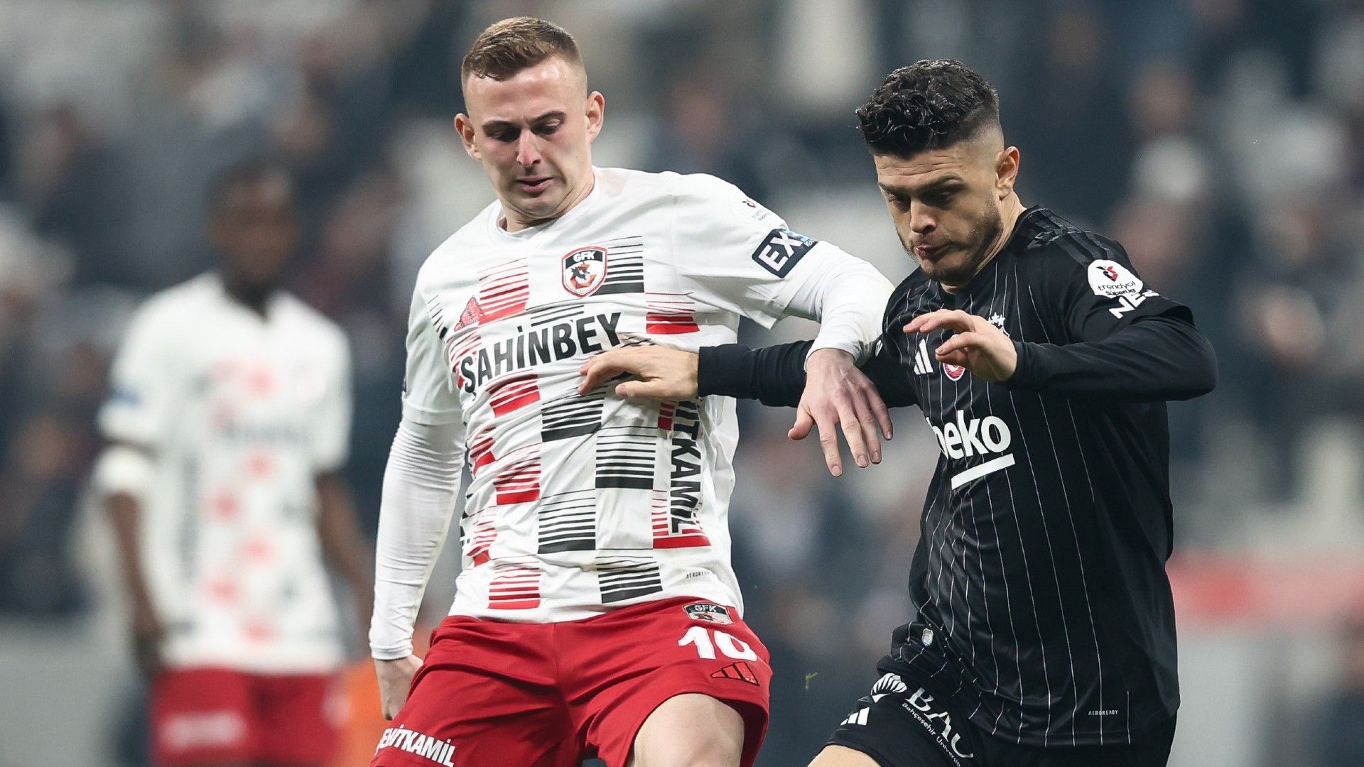 Milot Rashica of Besiktas is challenged by Kacper Kozlowski of Gaziantep 
