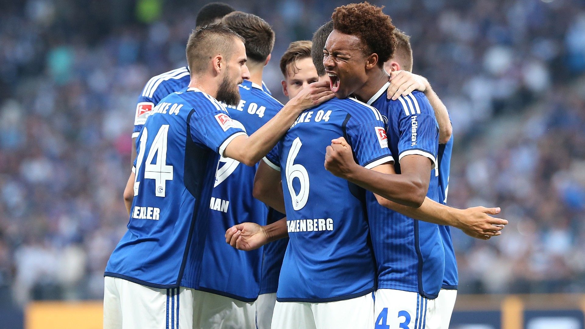 Assan Ouedraogo of FC Schalke 04 celebrates with his teammates
