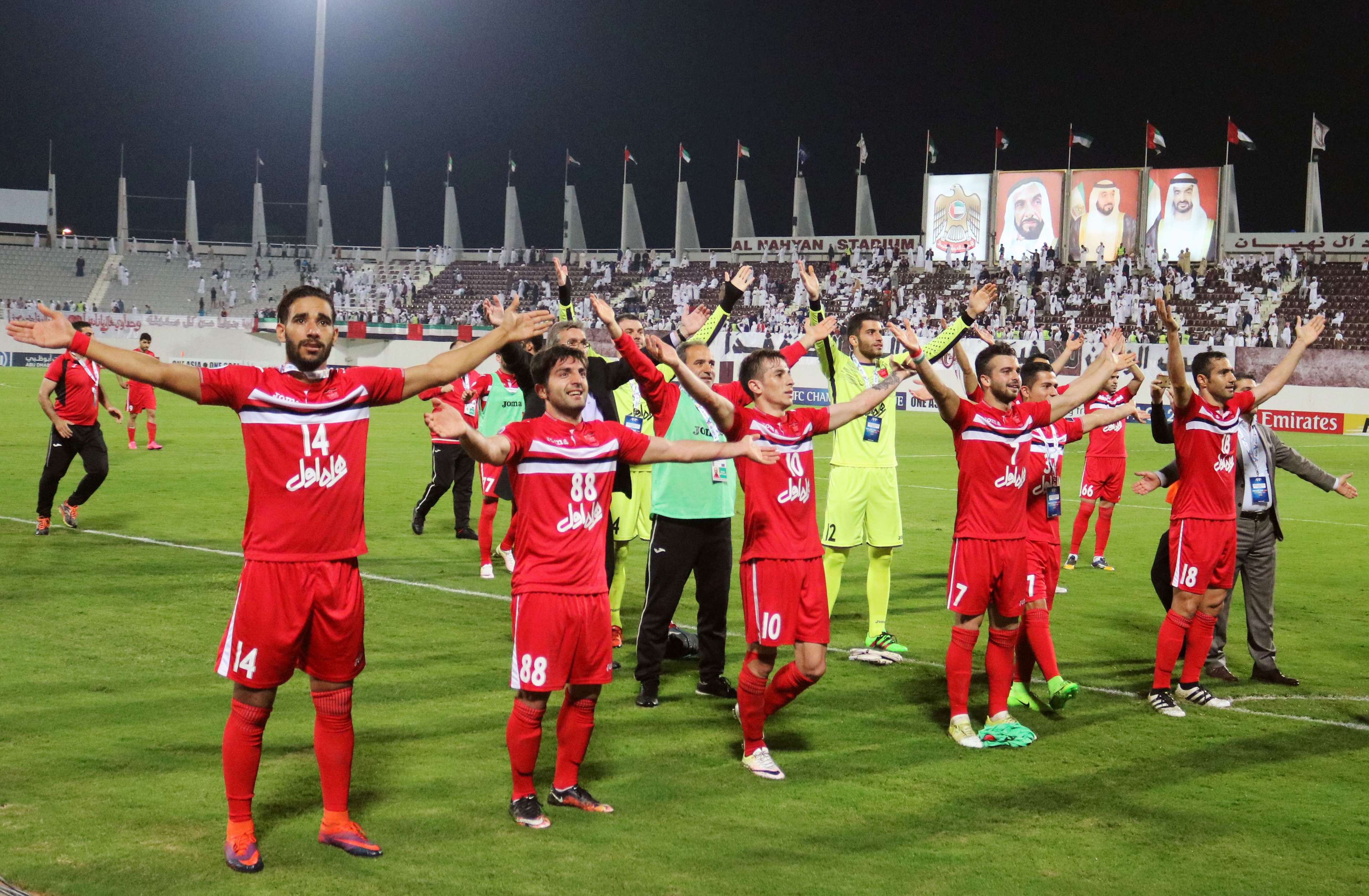 Persepolis's players celebrate after winning the AFC Champions League qualifying football match between UAE's Al-Wahda and Iran's Persepolis on February 28, 2017