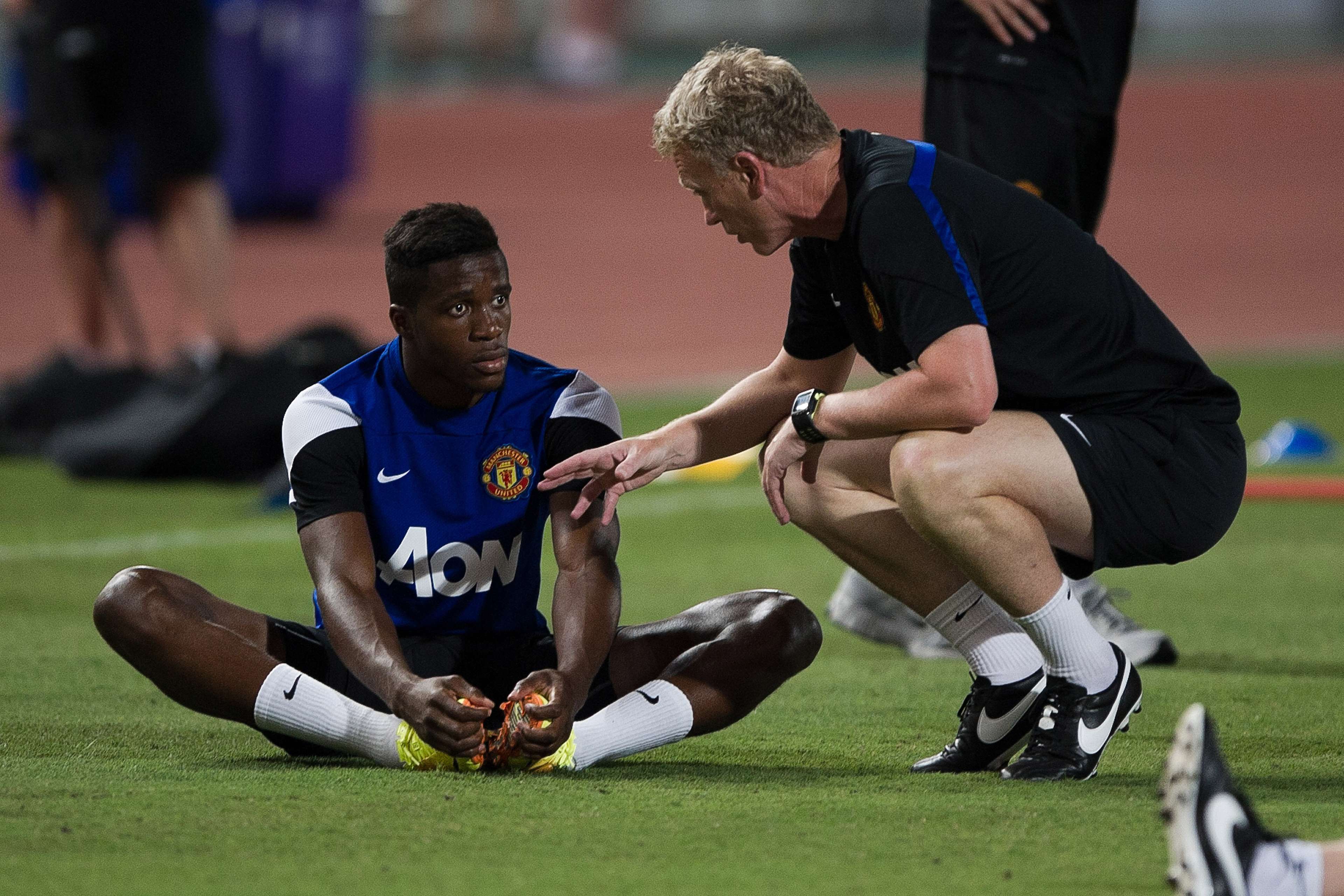 Manchester United manager David Moyes and winger Wilfried Zaha